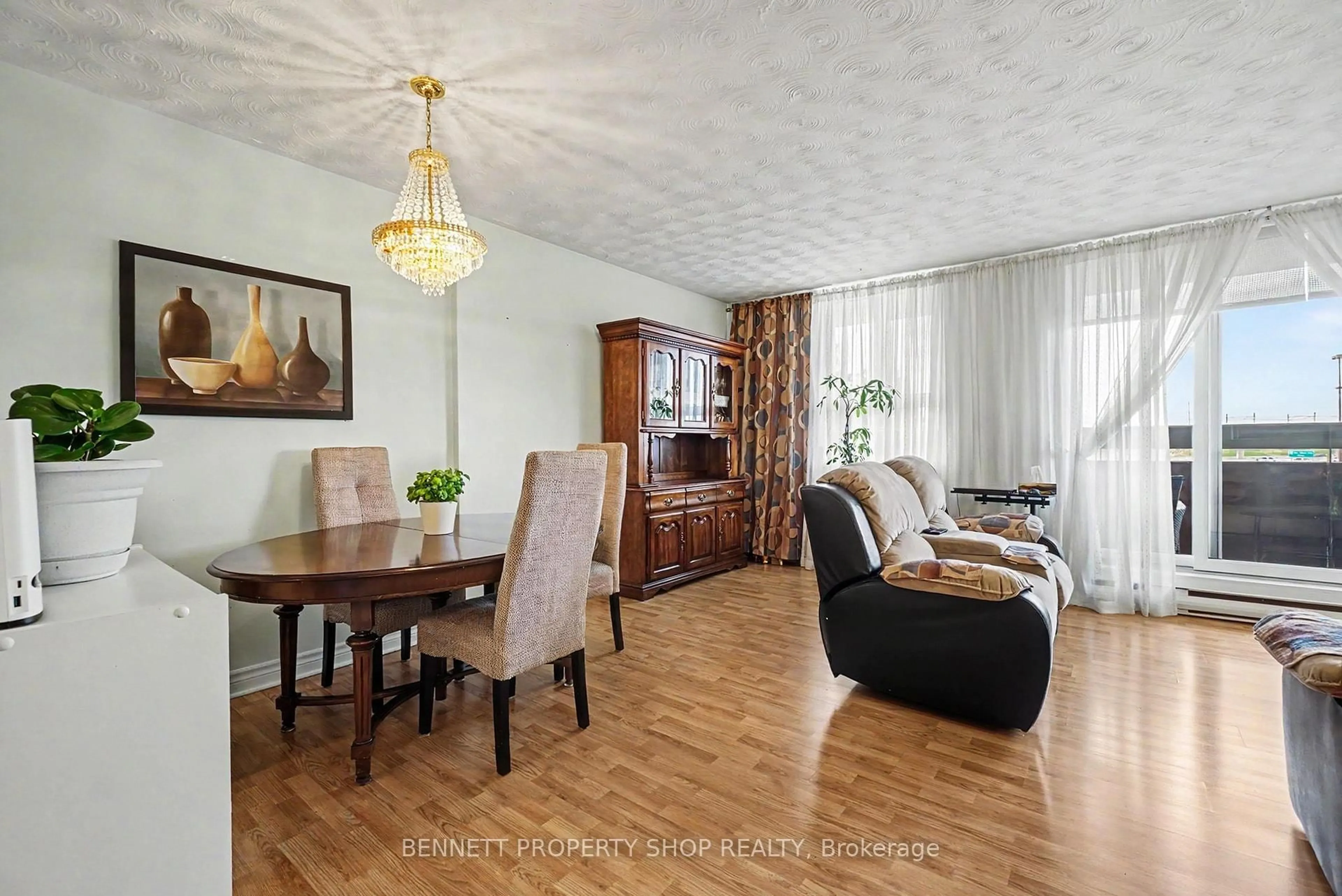 Living room with furniture, wood/laminate floor for 2000 Jasmine Cres #410, Ottawa Ontario K1J 8K4