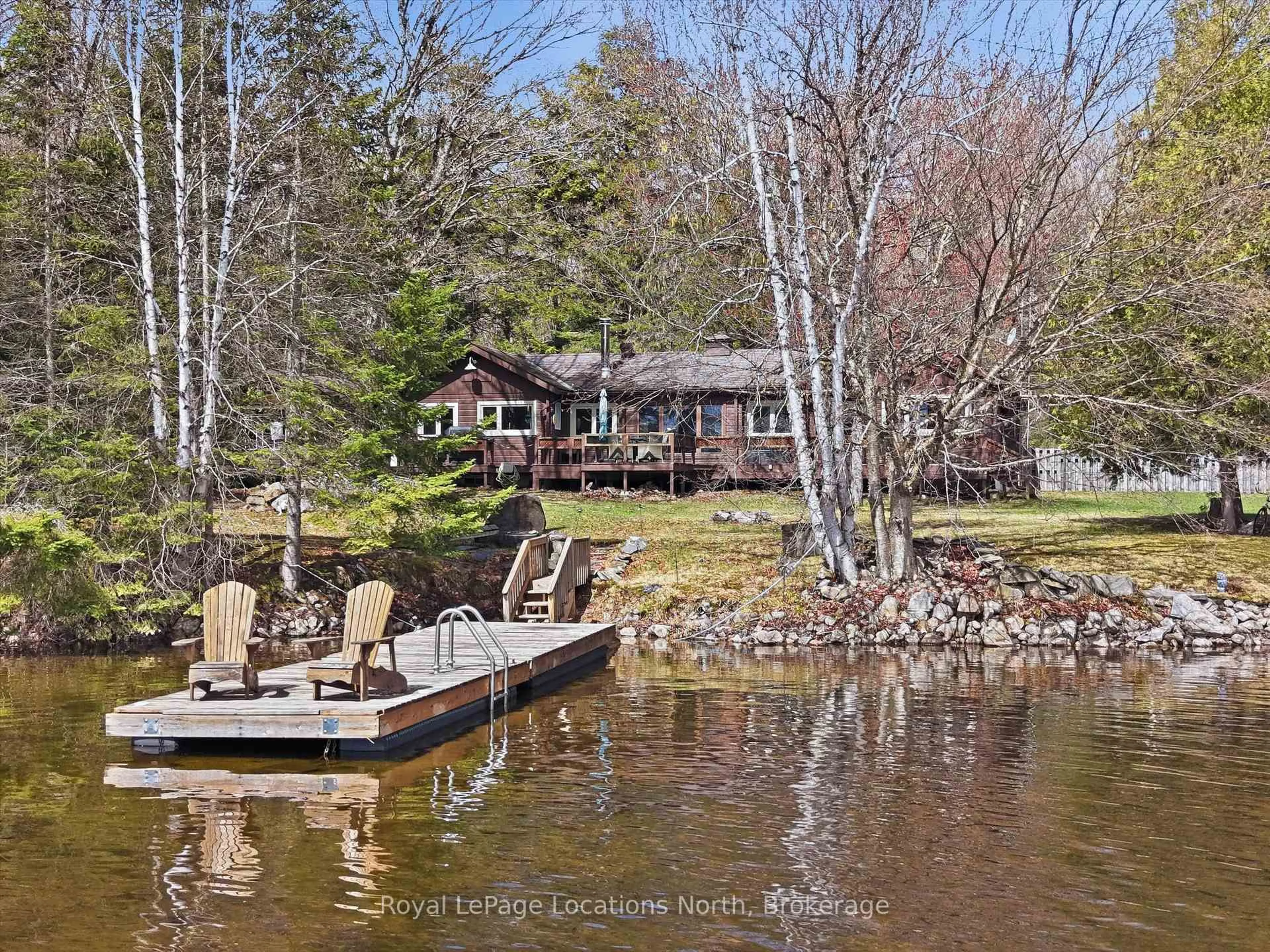 A pic from outside/outdoor area/front of a property/back of a property/a pic from drone, water/lake/river/ocean view for 1027 Scott Lane, Lake of Bays Ontario P1H 2J6