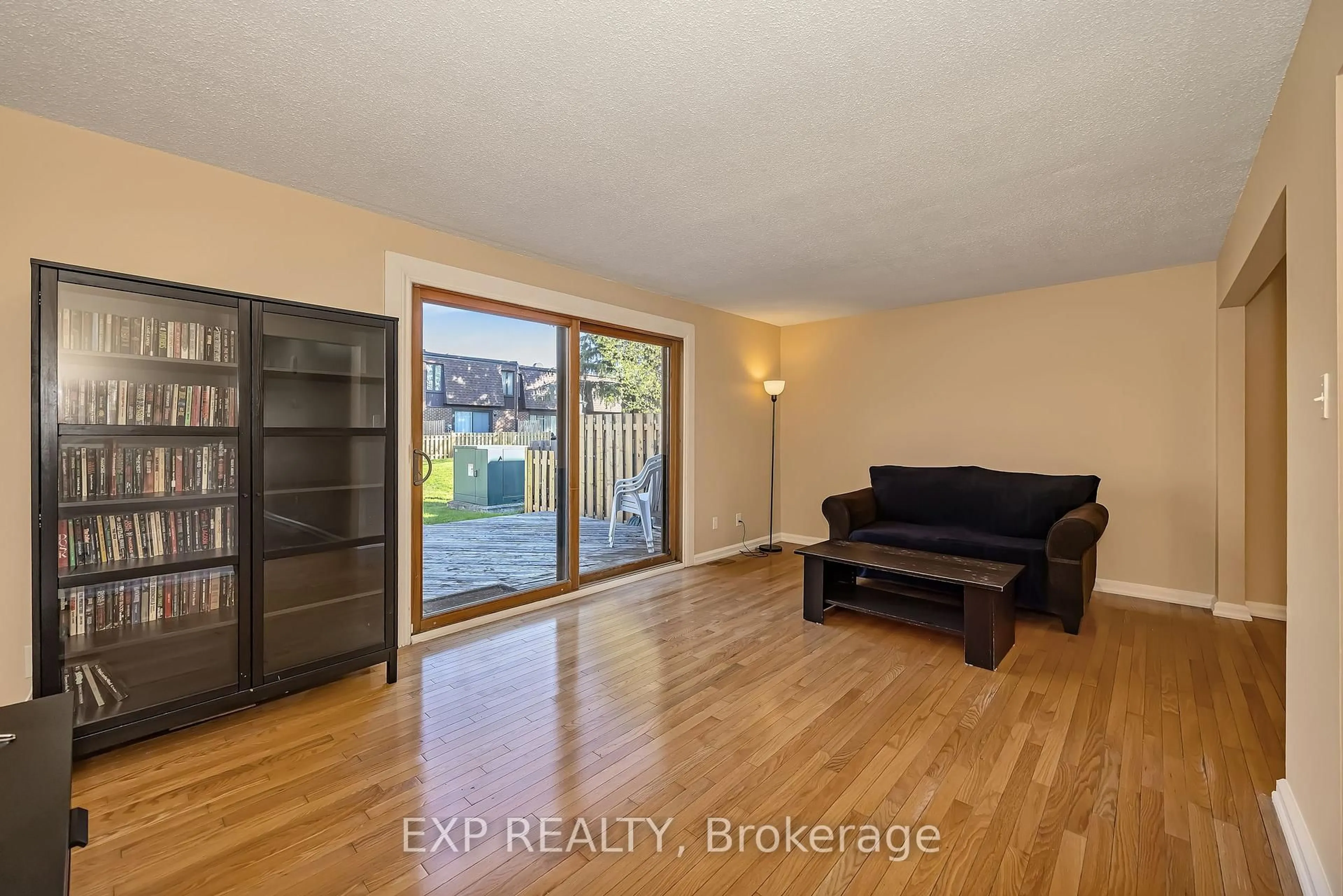 Living room with furniture, wood/laminate floor for 860 Cahill Dr #111, Ottawa Ontario K1V 9K5