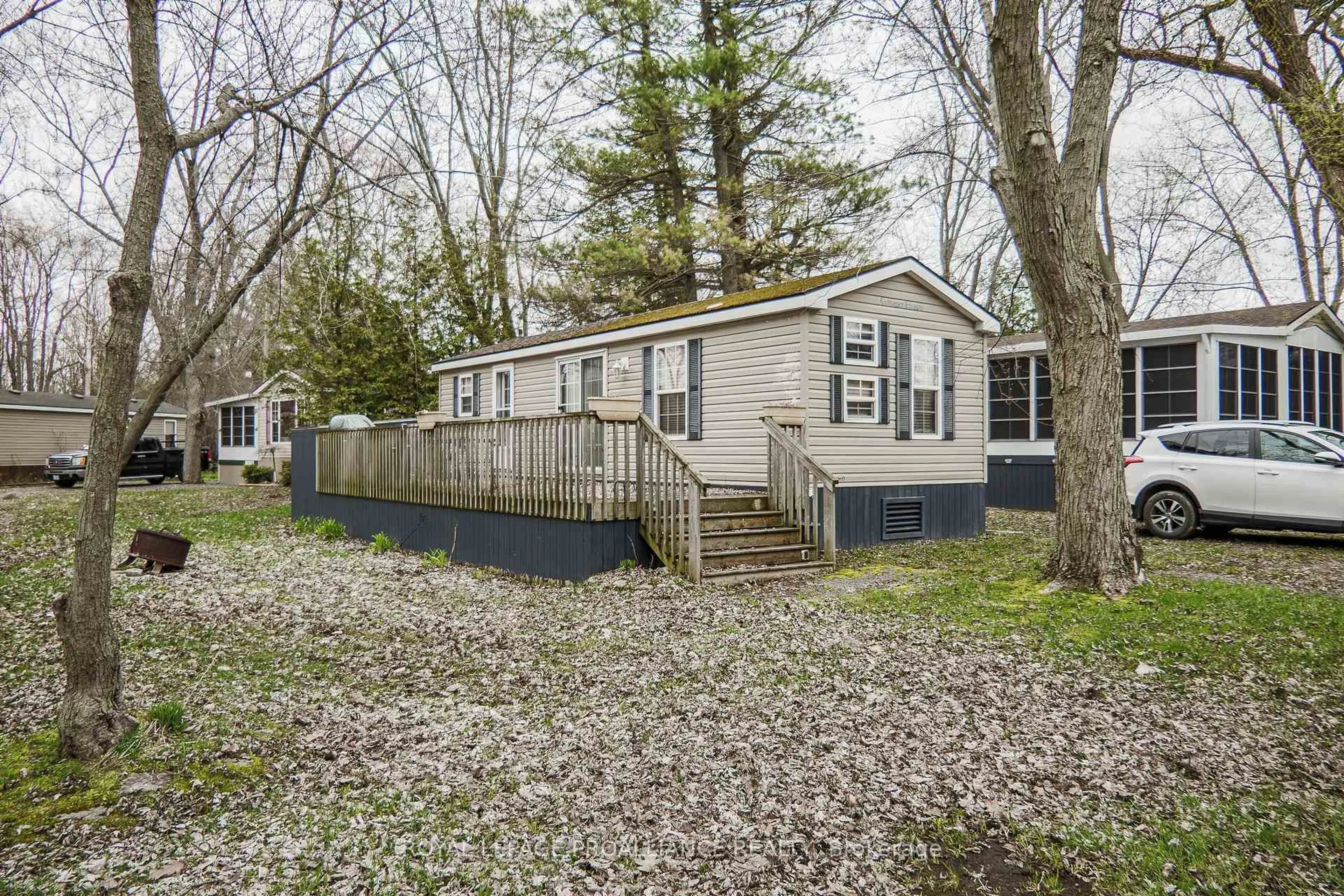 Home with vinyl exterior material, street for 486 County Rd 1 1 Park Meadow Lane, Prince Edward County Ontario K0K 1P0