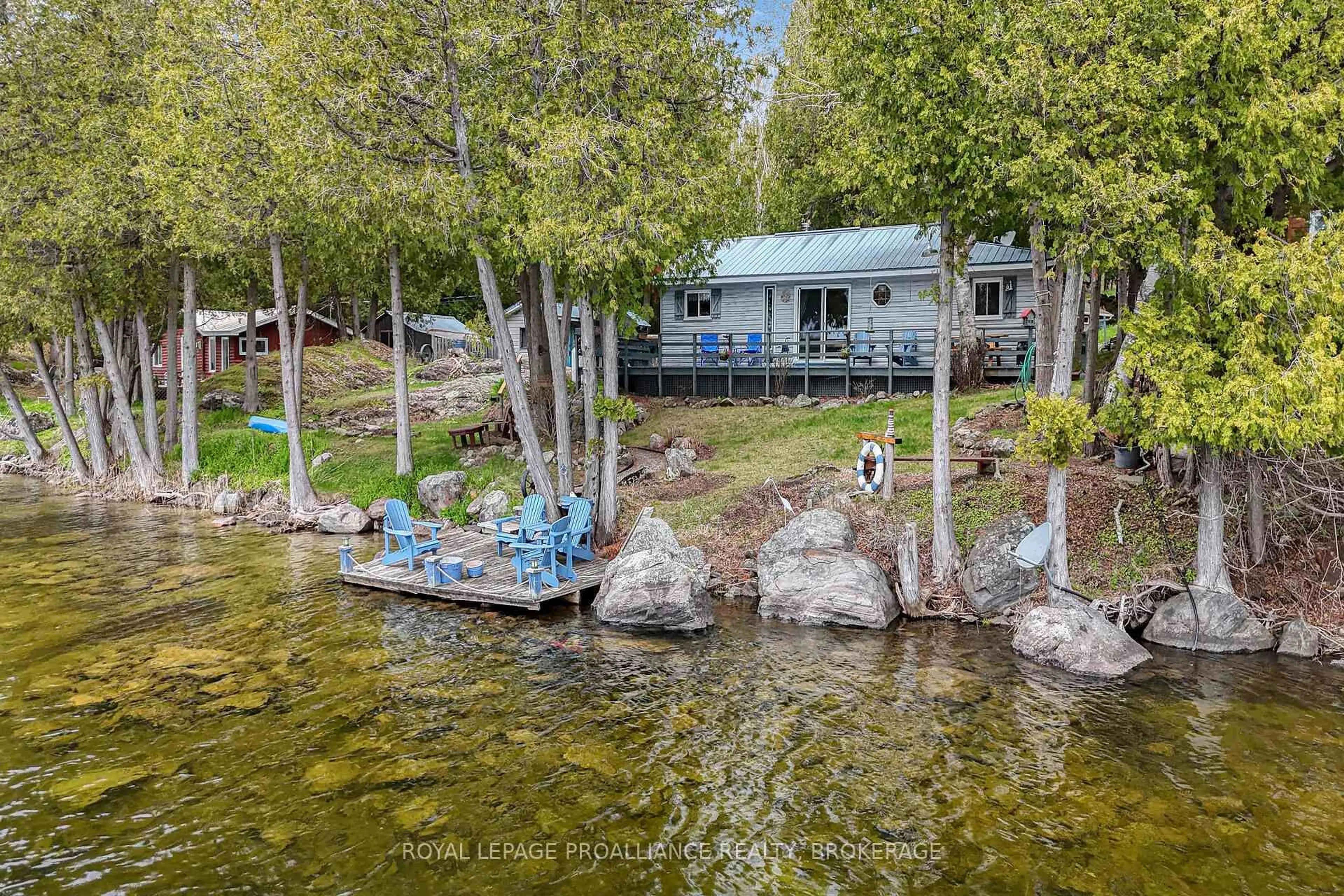 A pic from outside/outdoor area/front of a property/back of a property/a pic from drone, water/lake/river/ocean view for 173 Space Lane, Godfrey Ontario K0H 1T0