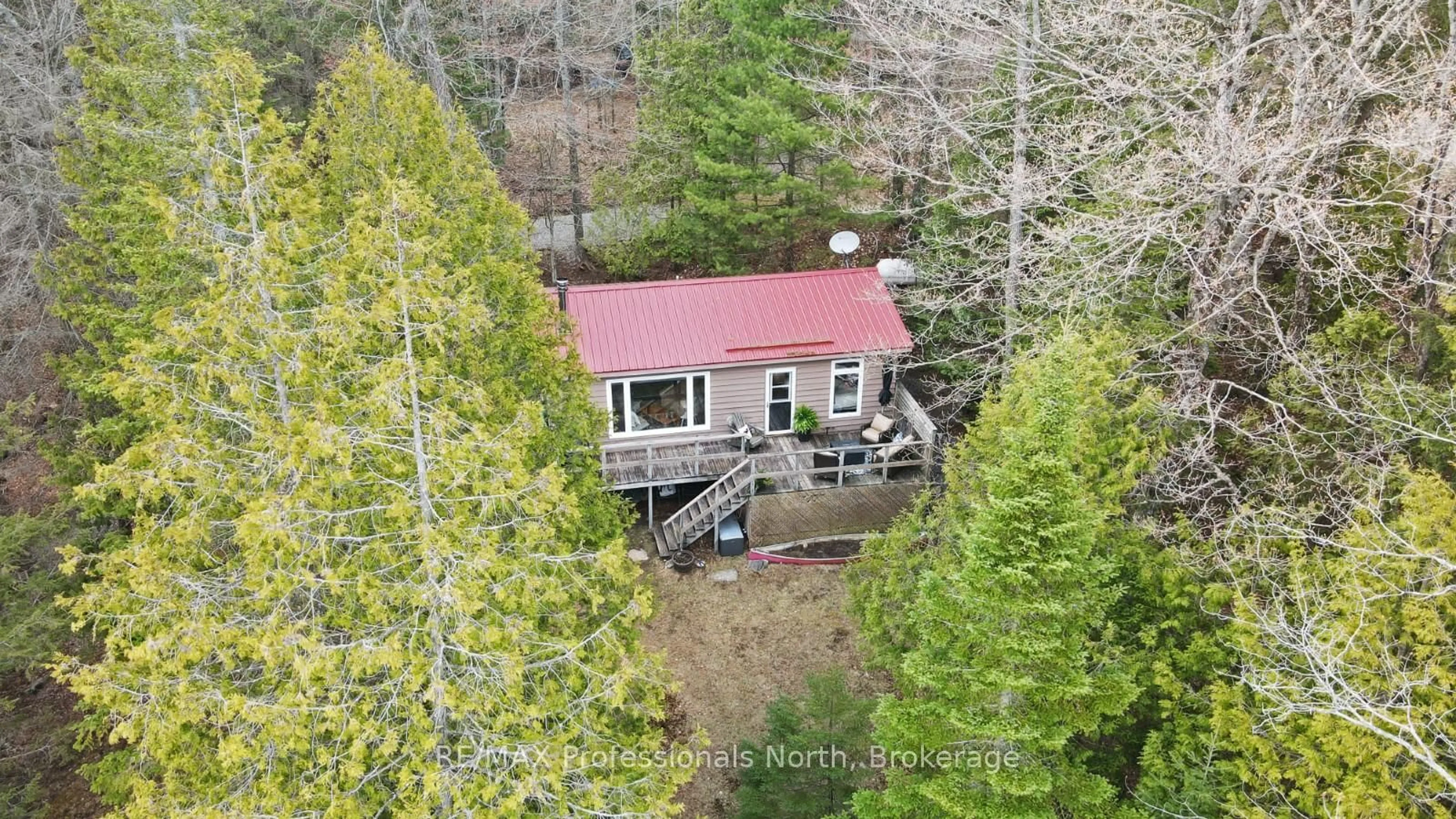 A pic from outside/outdoor area/front of a property/back of a property/a pic from drone, forest/trees view for 1107 PLUTO Tr, Dysart et al Ontario K0M 1S0