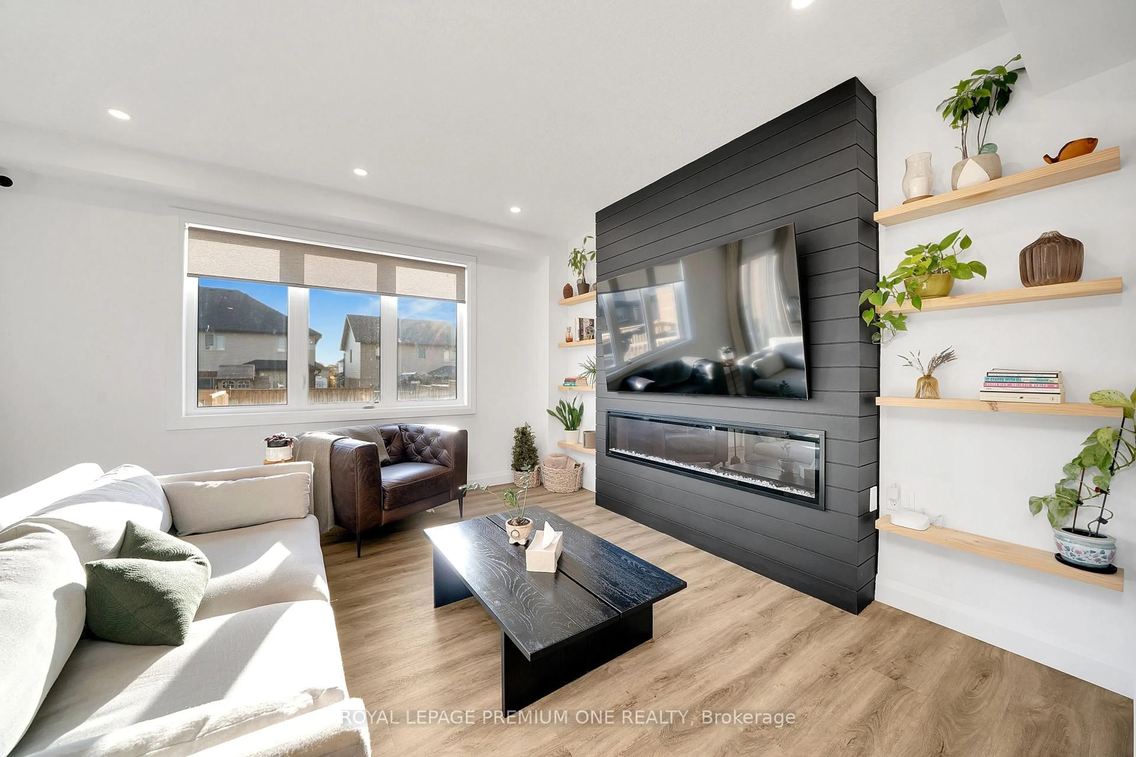 Living room with furniture, wood/laminate floor for 207 Schmidt Dr, Wellington North Ontario N0G 1A0