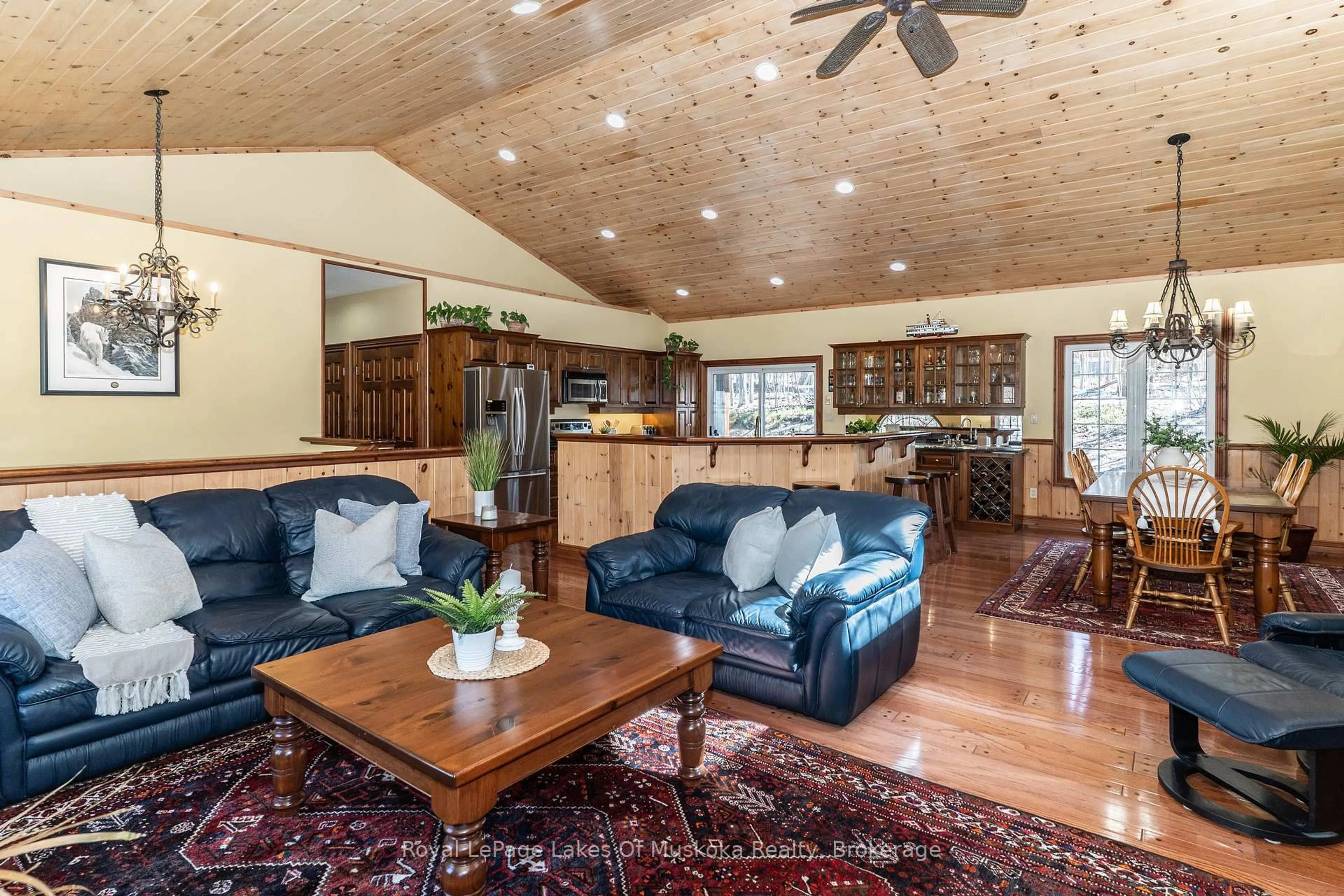 Living room with furniture, wood/laminate floor for 22 Duke St, Muskoka Lakes Ontario P0B 1J0