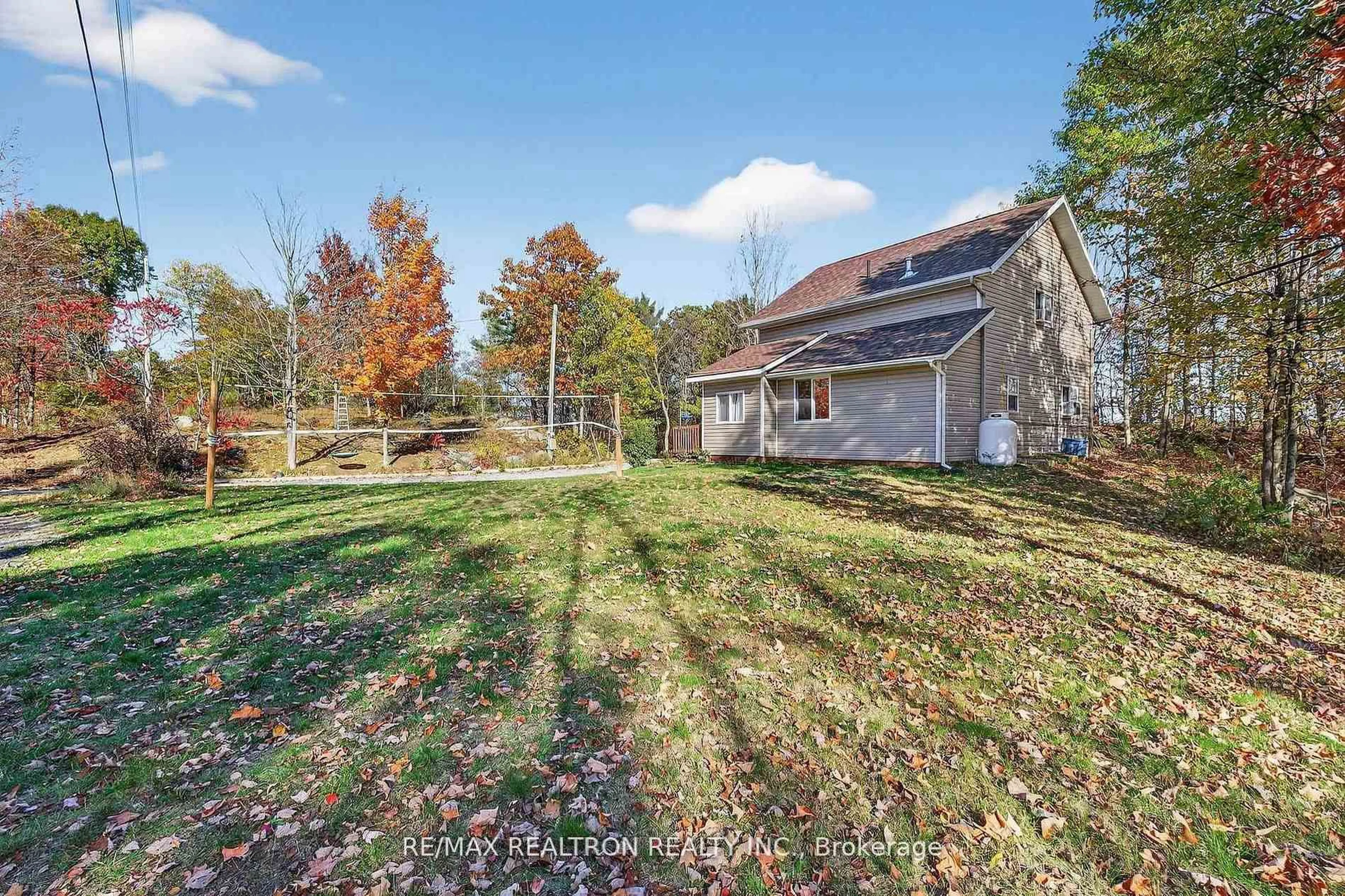A pic from outside/outdoor area/front of a property/back of a property/a pic from drone, water/lake/river/ocean view for 1073 Freeman Lane, Godfrey Ontario K0H 1T0