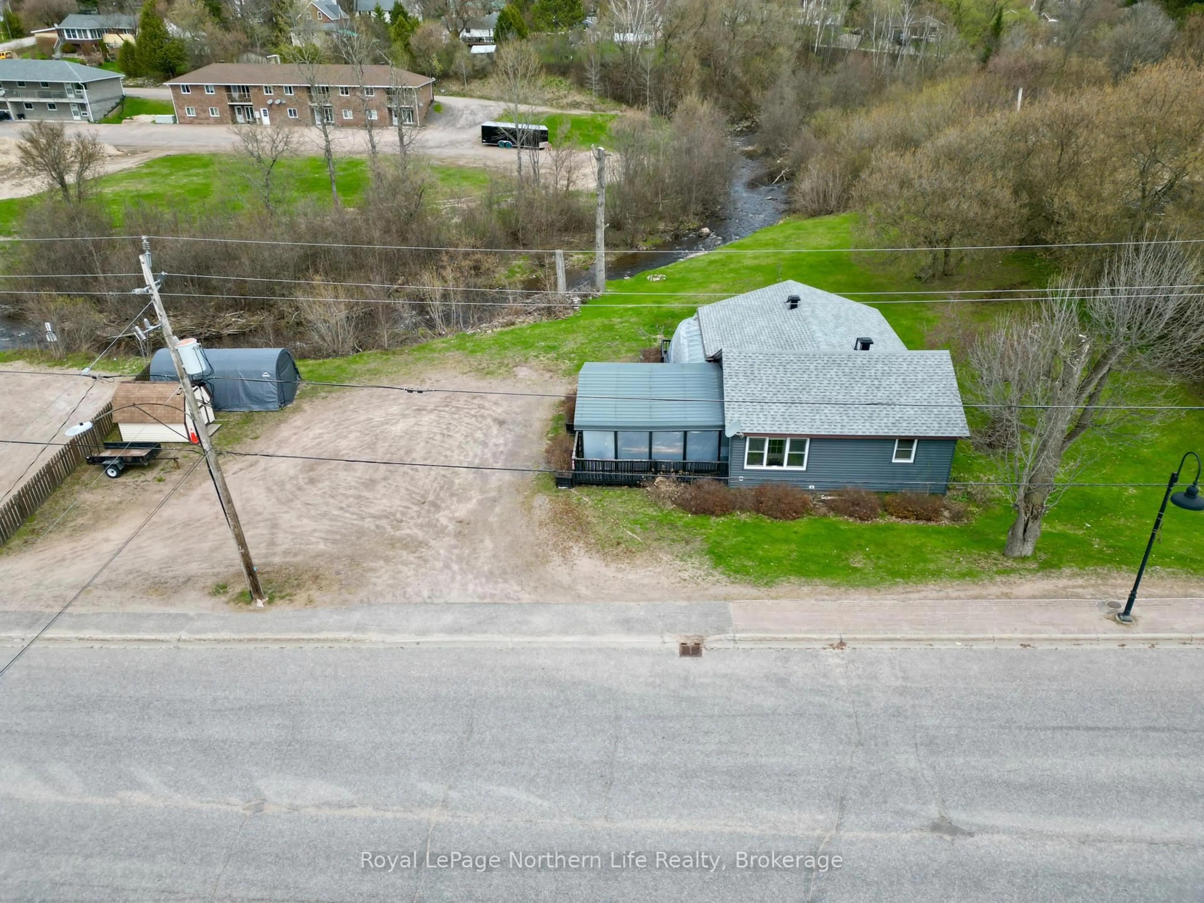 A pic from outside/outdoor area/front of a property/back of a property/a pic from drone, street for 440 Main St, Powassan Ontario P0H 1Z0