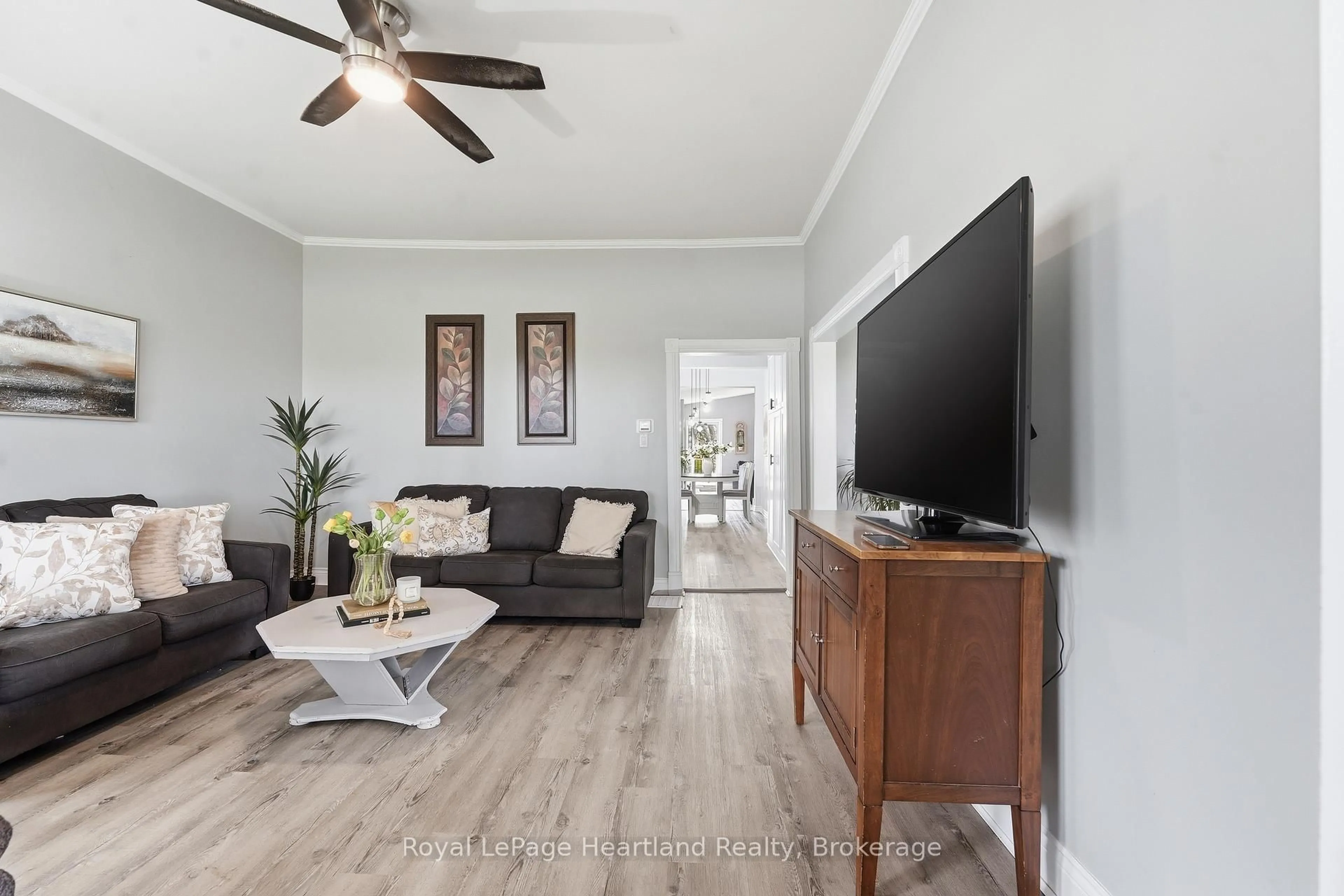 Living room with furniture, wood/laminate floor for 27 Harpurhey Rd, Huron East Ontario N0K 1W0