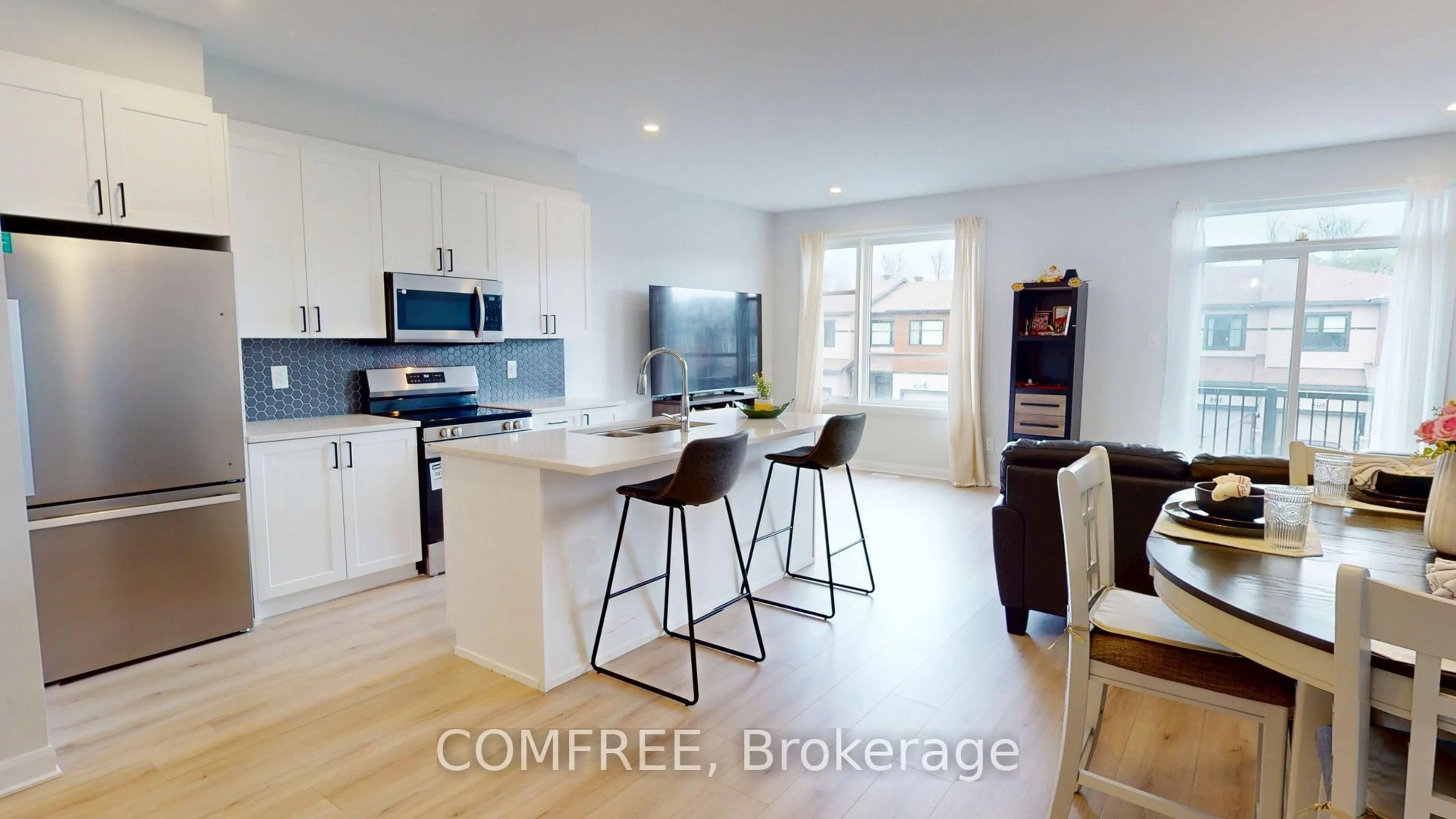 Open concept kitchen, wood/laminate floor for 272 Elsie Macgill Walk, Kanata Ontario K2W 0L2