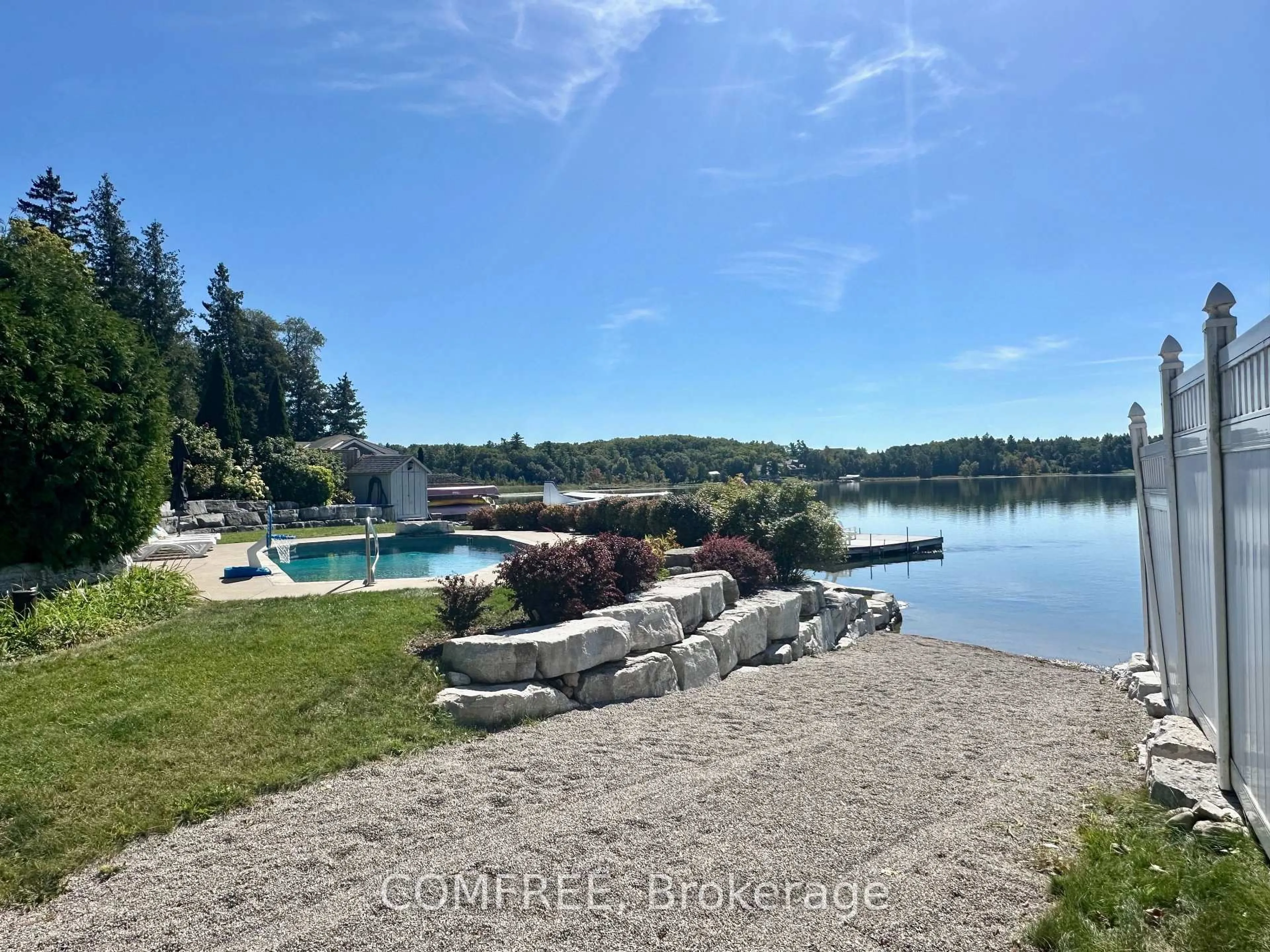 A pic from outside/outdoor area/front of a property/back of a property/a pic from drone, water/lake/river/ocean view for 11 Lake Ave, Puslinch Ontario N3C 2V4