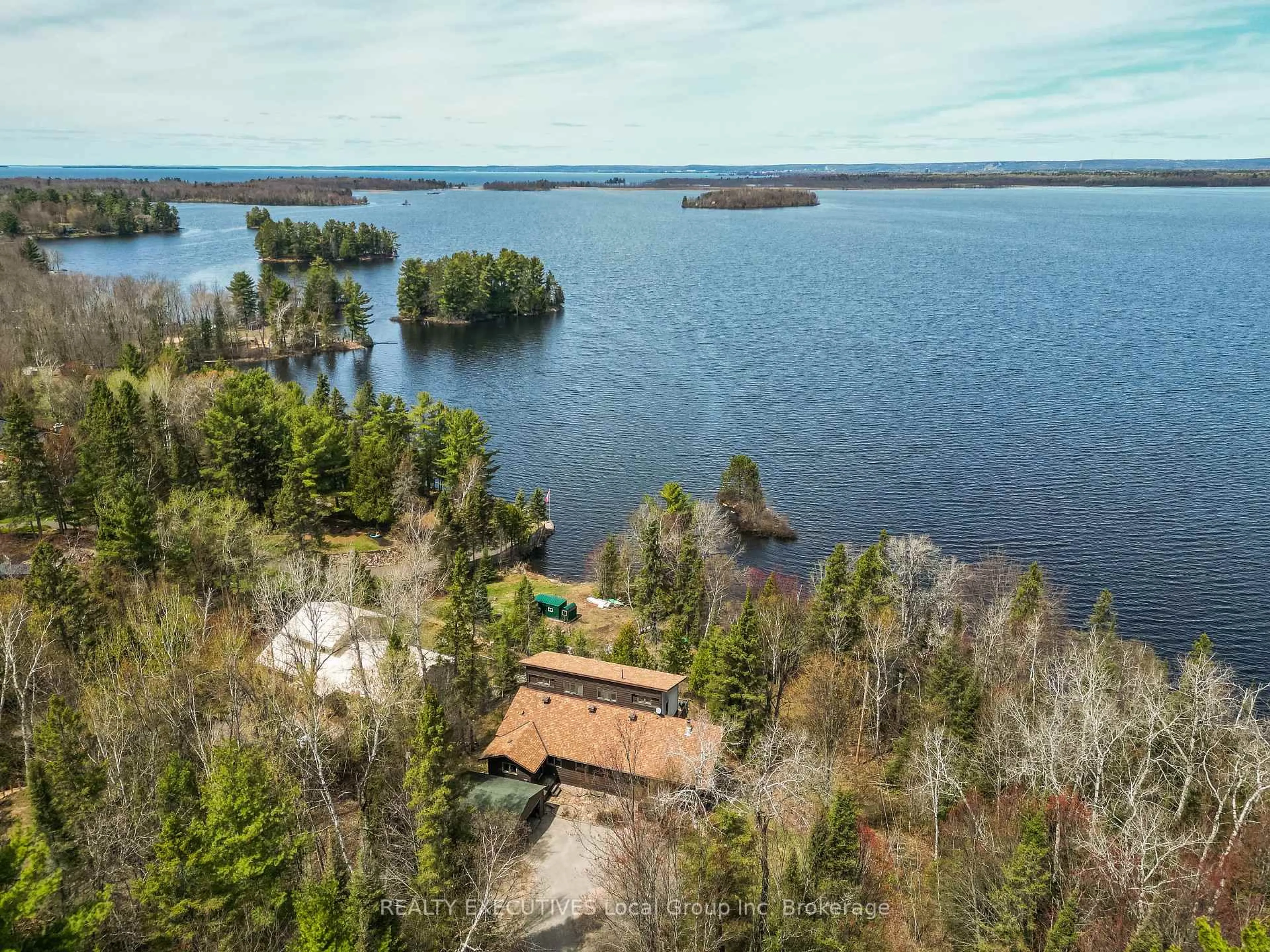 A pic from outside/outdoor area/front of a property/back of a property/a pic from drone, water/lake/river/ocean view for 410 Pinecreek Cres, Callander Ontario P0H 1H0