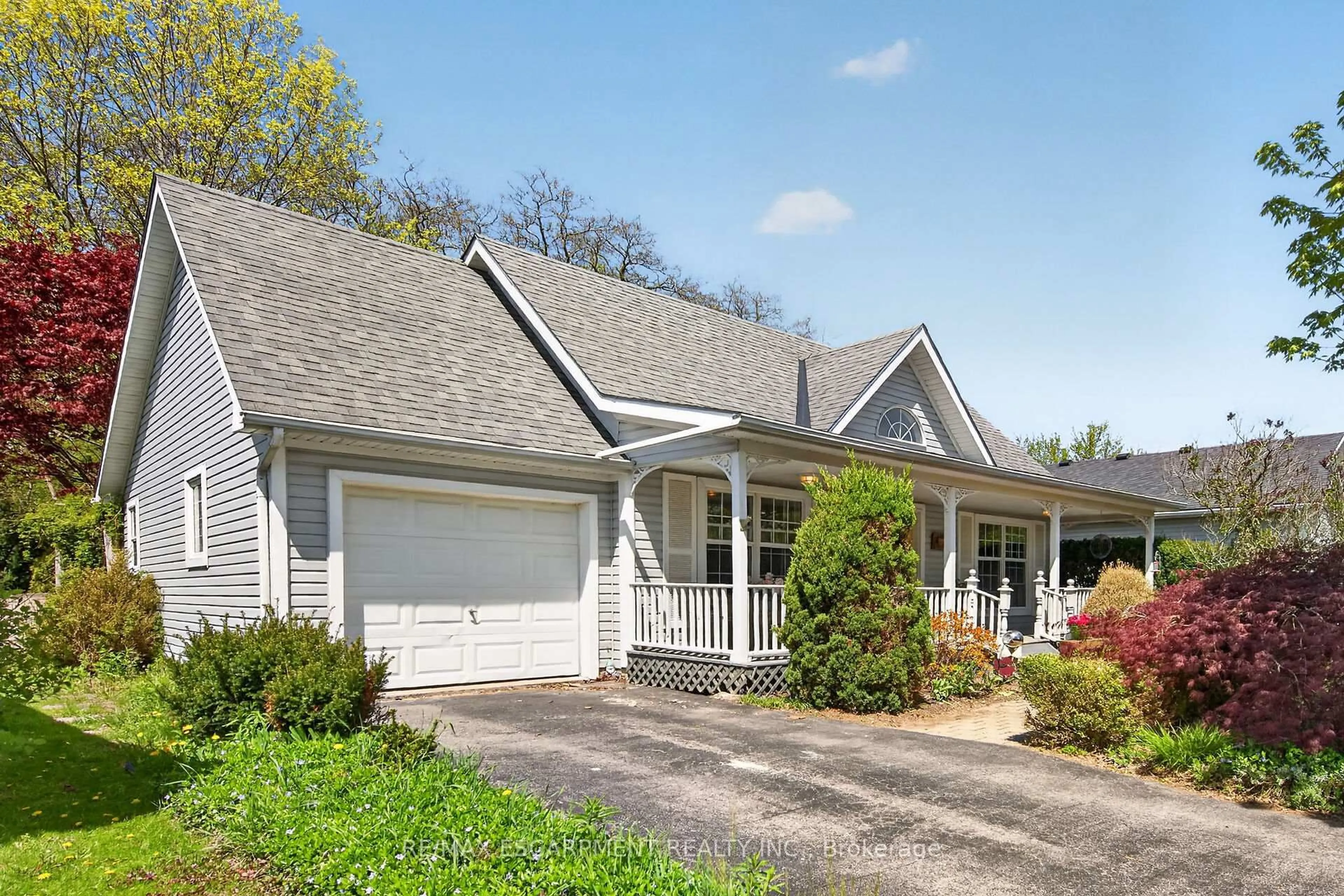 Home with vinyl exterior material, street for 5 Denby Rd, Norfolk Ontario N0A 1N4