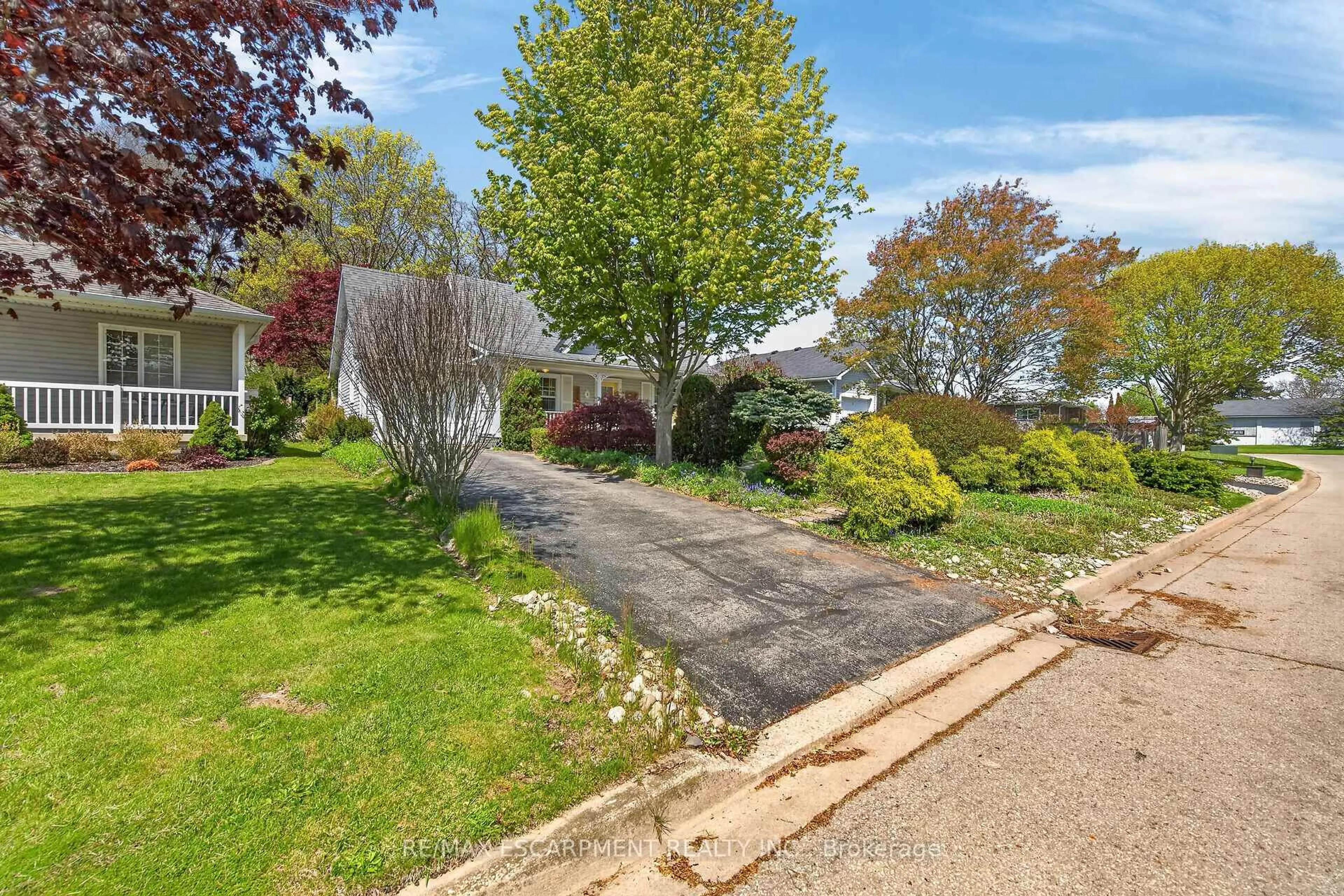 A pic from outside/outdoor area/front of a property/back of a property/a pic from drone, street for 5 Denby Rd, Norfolk Ontario N0A 1N4