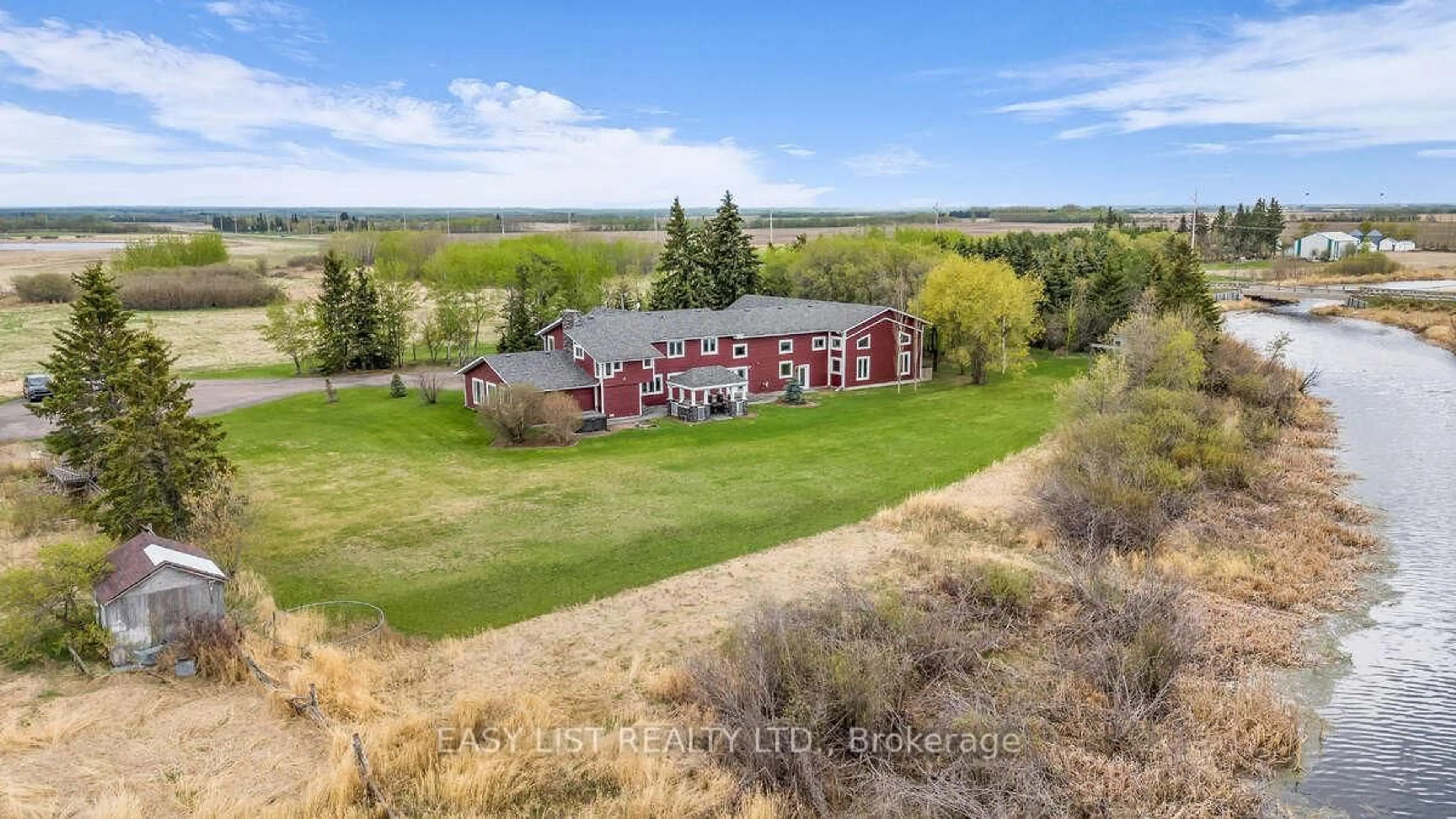A pic from outside/outdoor area/front of a property/back of a property/a pic from drone, unknown for NW 14 59 17 W3, Out of Area SK S9X 1Z5