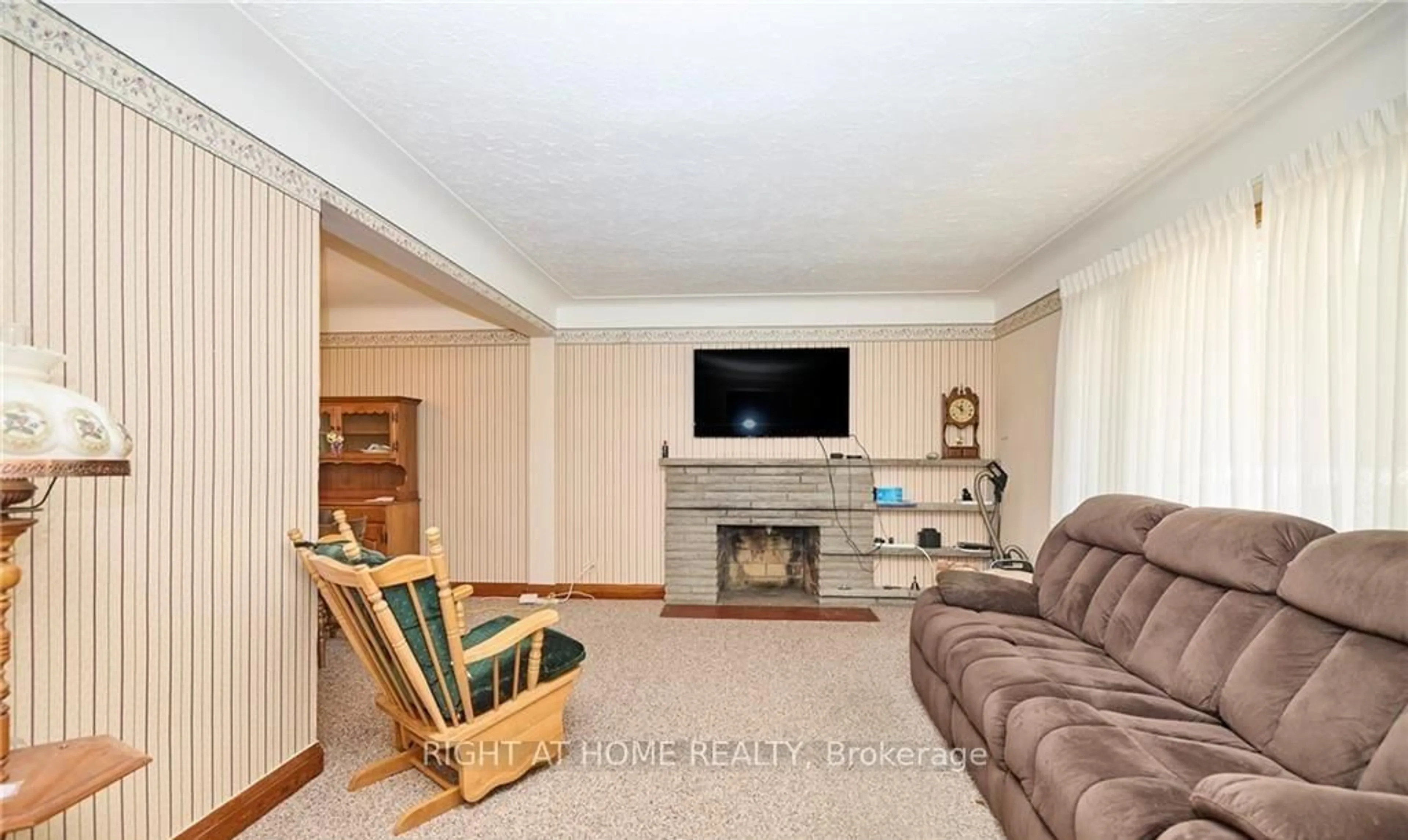 Living room with furniture, unknown for 6357 Dorchester Rd, Niagara Falls Ontario L2G 5T4