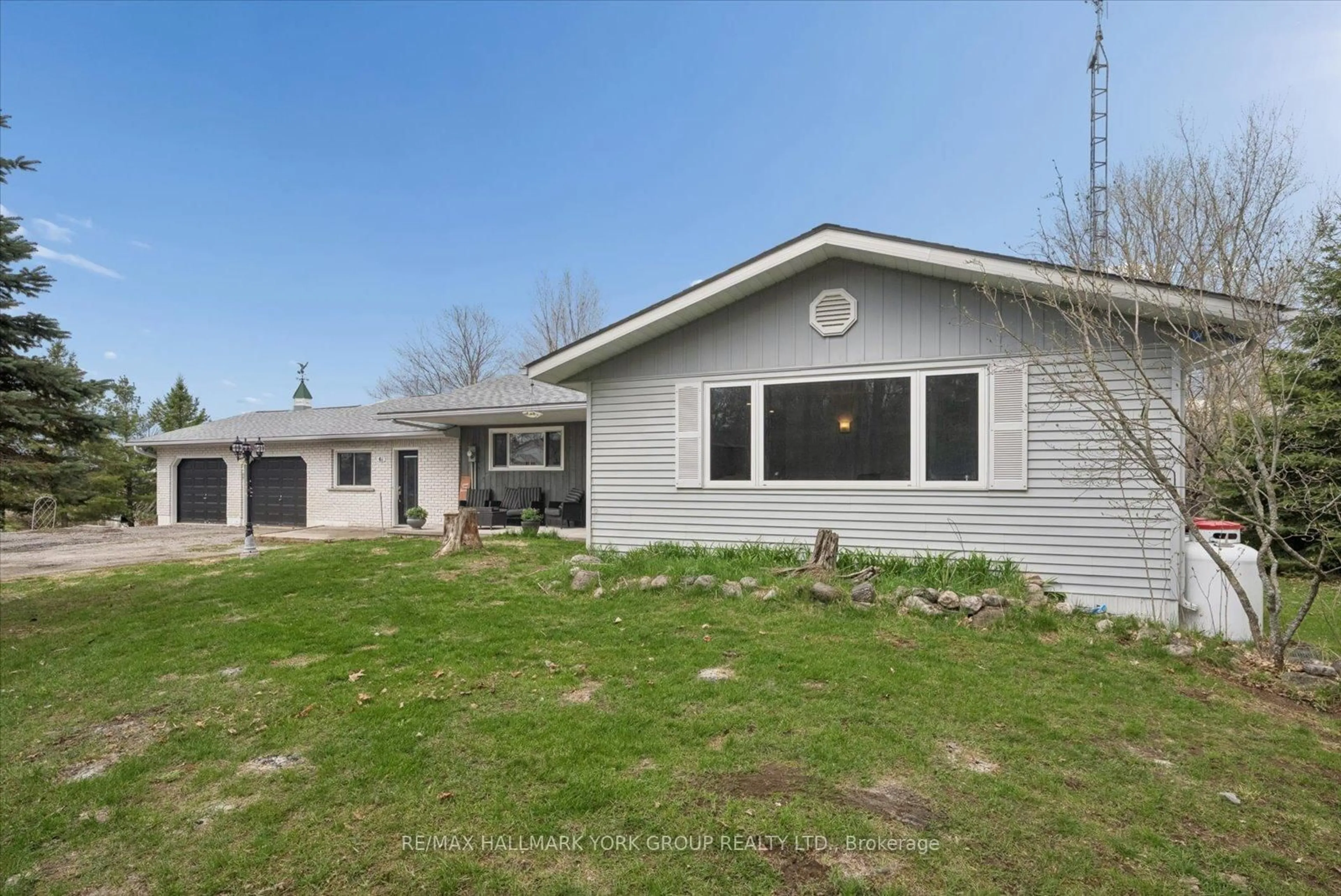 Home with vinyl exterior material, street for 61 Concession Rd 3, Kawartha Lakes Ontario K0M 1N0