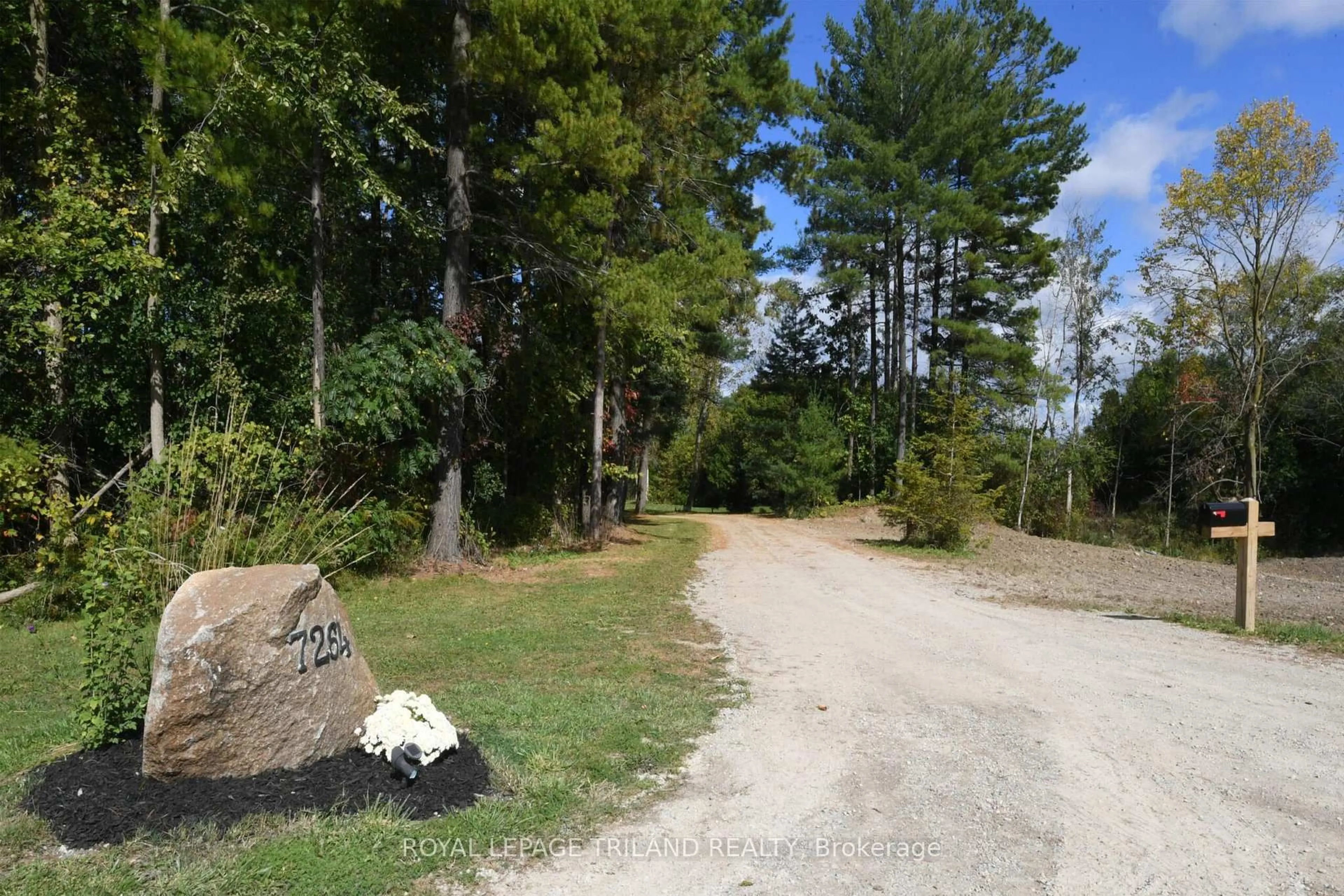 A pic from outside/outdoor area/front of a property/back of a property/a pic from drone, forest/trees view for 7264 Ridge Rd, Lambton Shores Ontario N0N 1J3