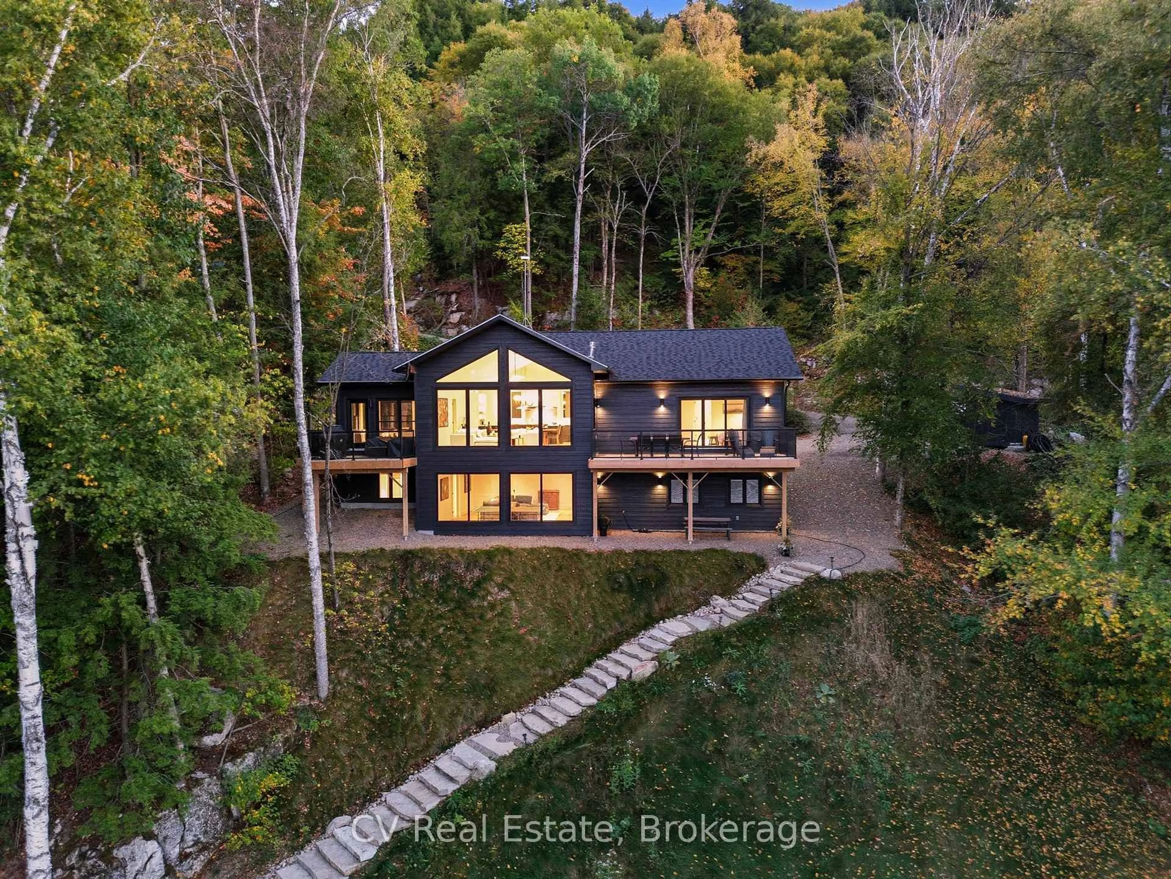 A pic from outside/outdoor area/front of a property/back of a property/a pic from drone, water/lake/river/ocean view for 1399 Baybreeze Lane, Dysart et al Ontario K0M 1S0