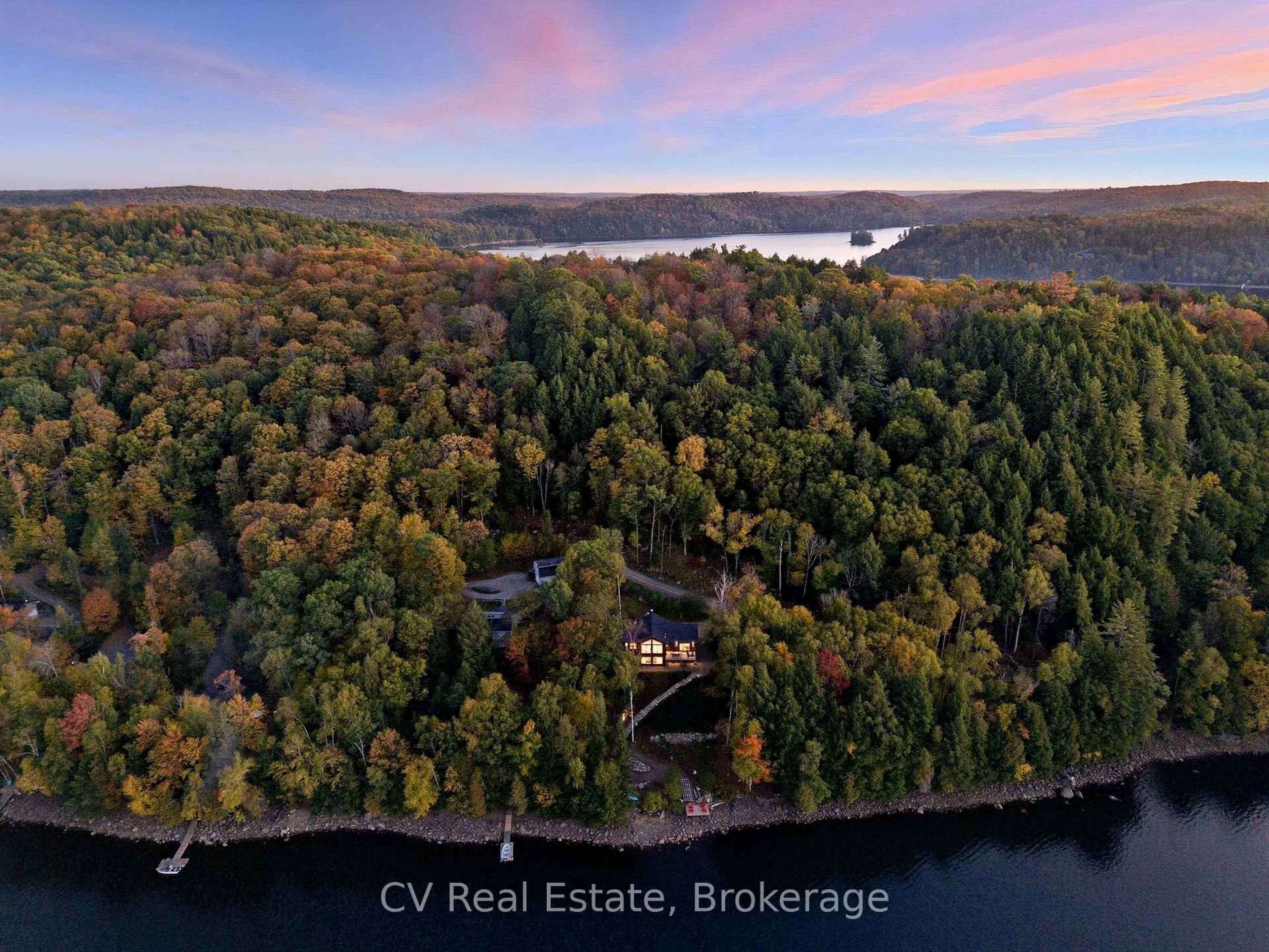 A pic from outside/outdoor area/front of a property/back of a property/a pic from drone, water/lake/river/ocean view for 1399 Baybreeze Lane, Dysart et al Ontario K0M 1S0