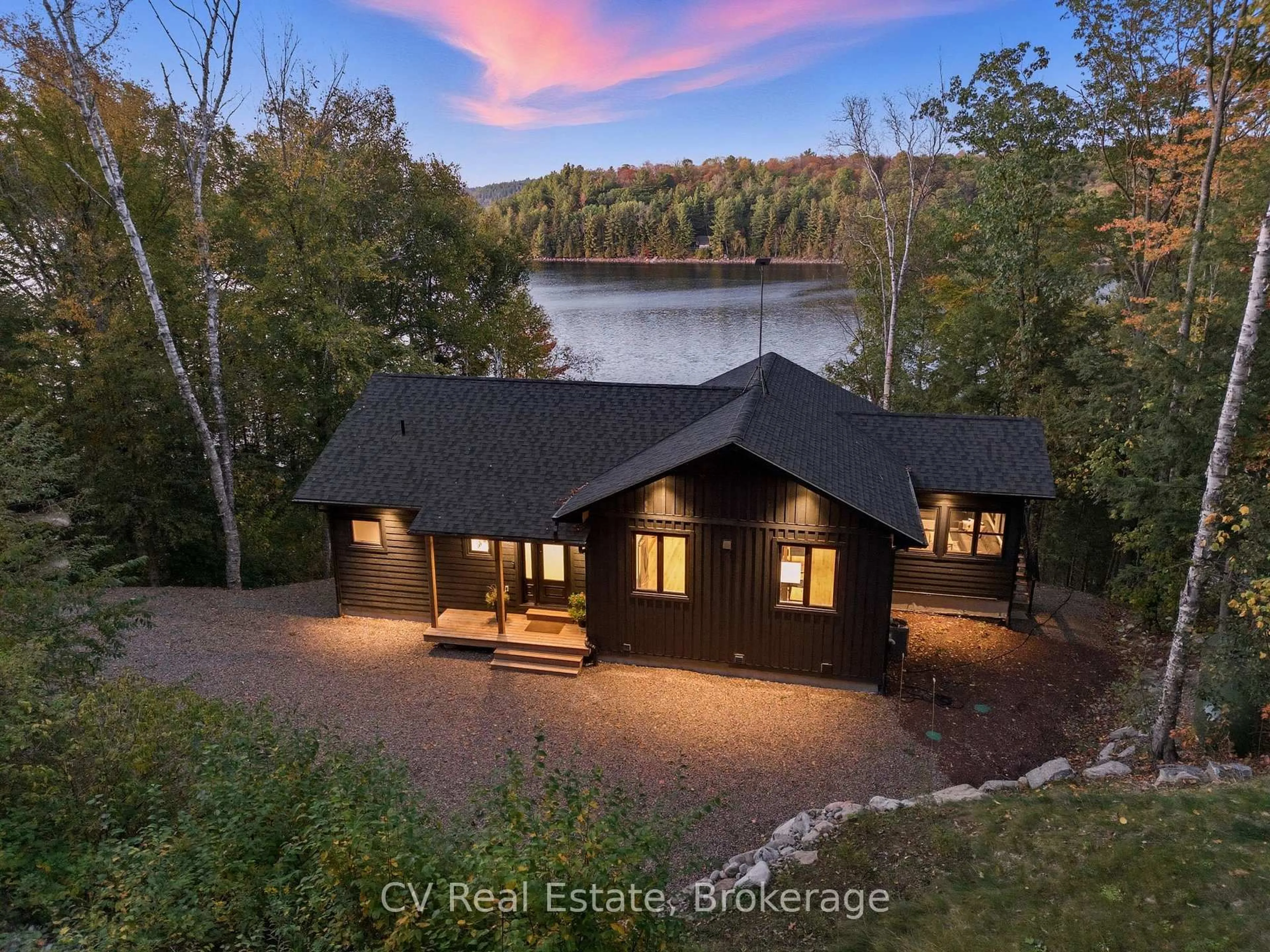 A pic from outside/outdoor area/front of a property/back of a property/a pic from drone, water/lake/river/ocean view for 1399 Baybreeze Lane, Dysart et al Ontario K0M 1S0