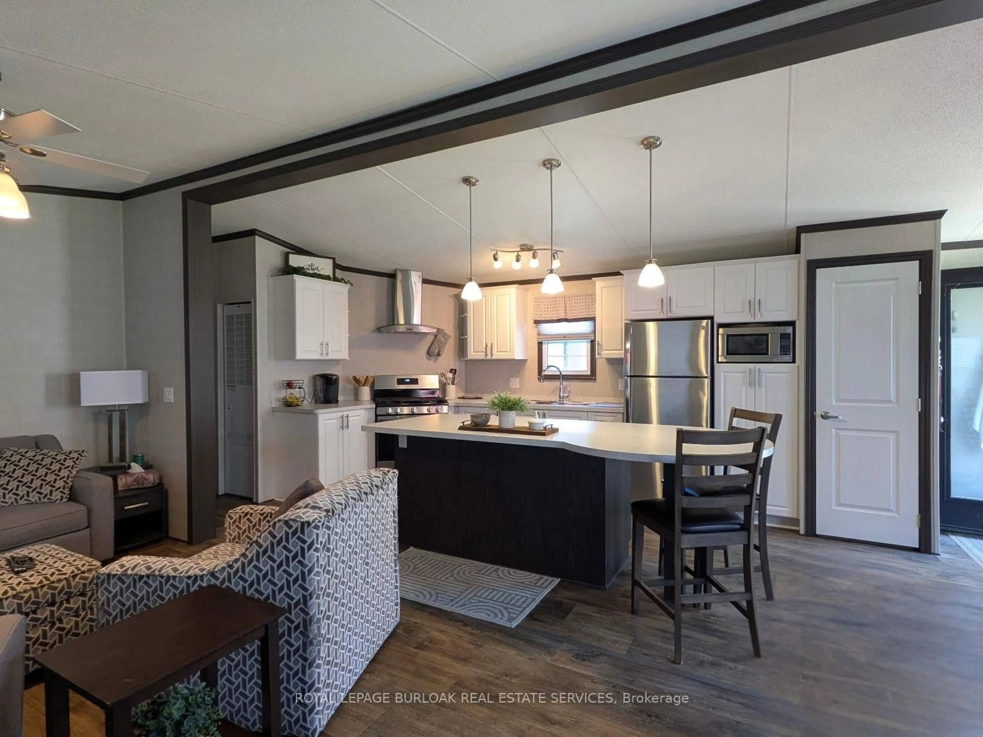 Open concept kitchen, wood/laminate floor for 1235 Villiers Line #CHYHILL054, Otonabee-South Monaghan Ontario K0L 2G0