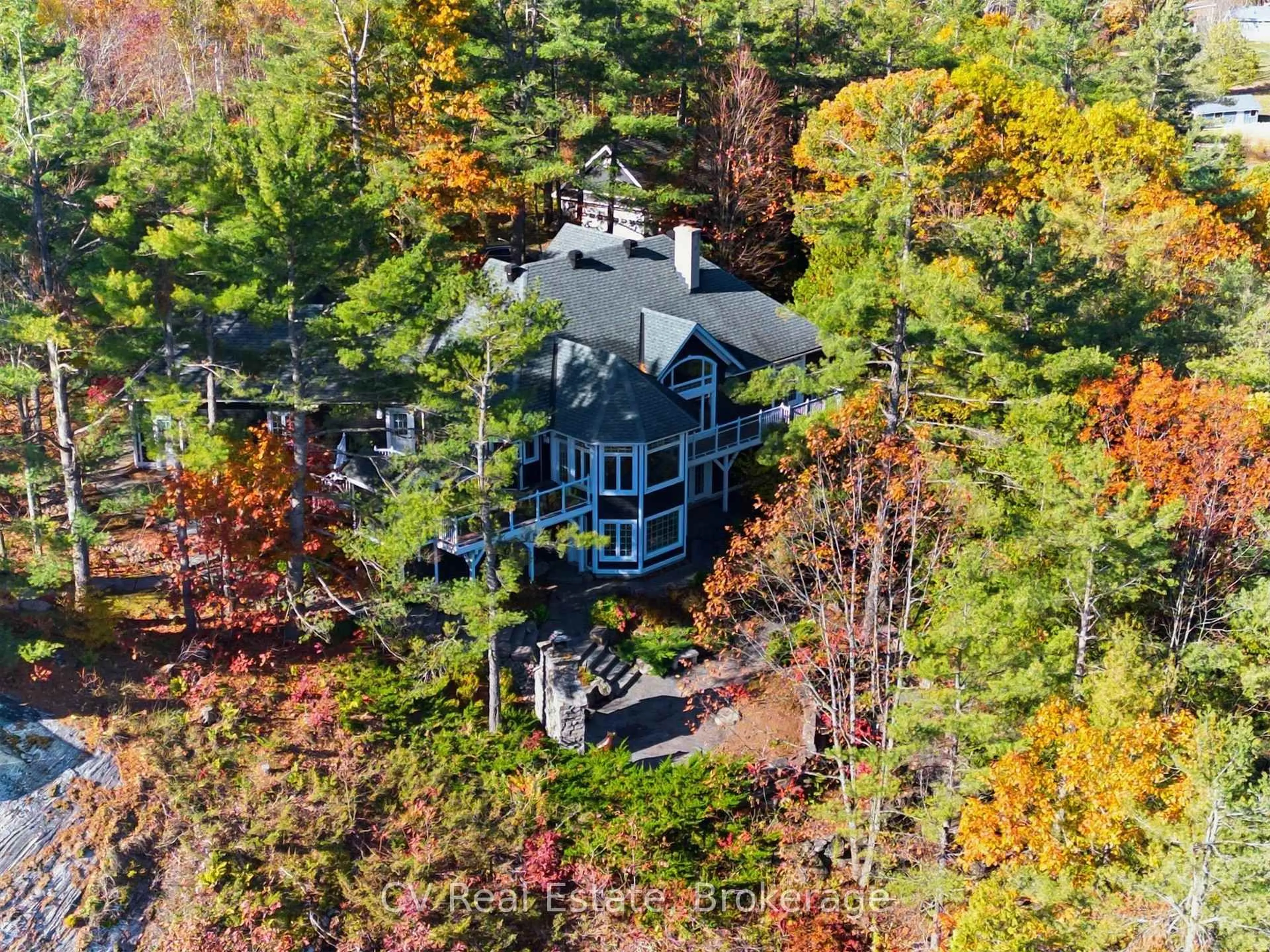 A pic from outside/outdoor area/front of a property/back of a property/a pic from drone, forest/trees view for 1060 S Sunset Bay Rd, Gravenhurst Ontario P1P 1R2
