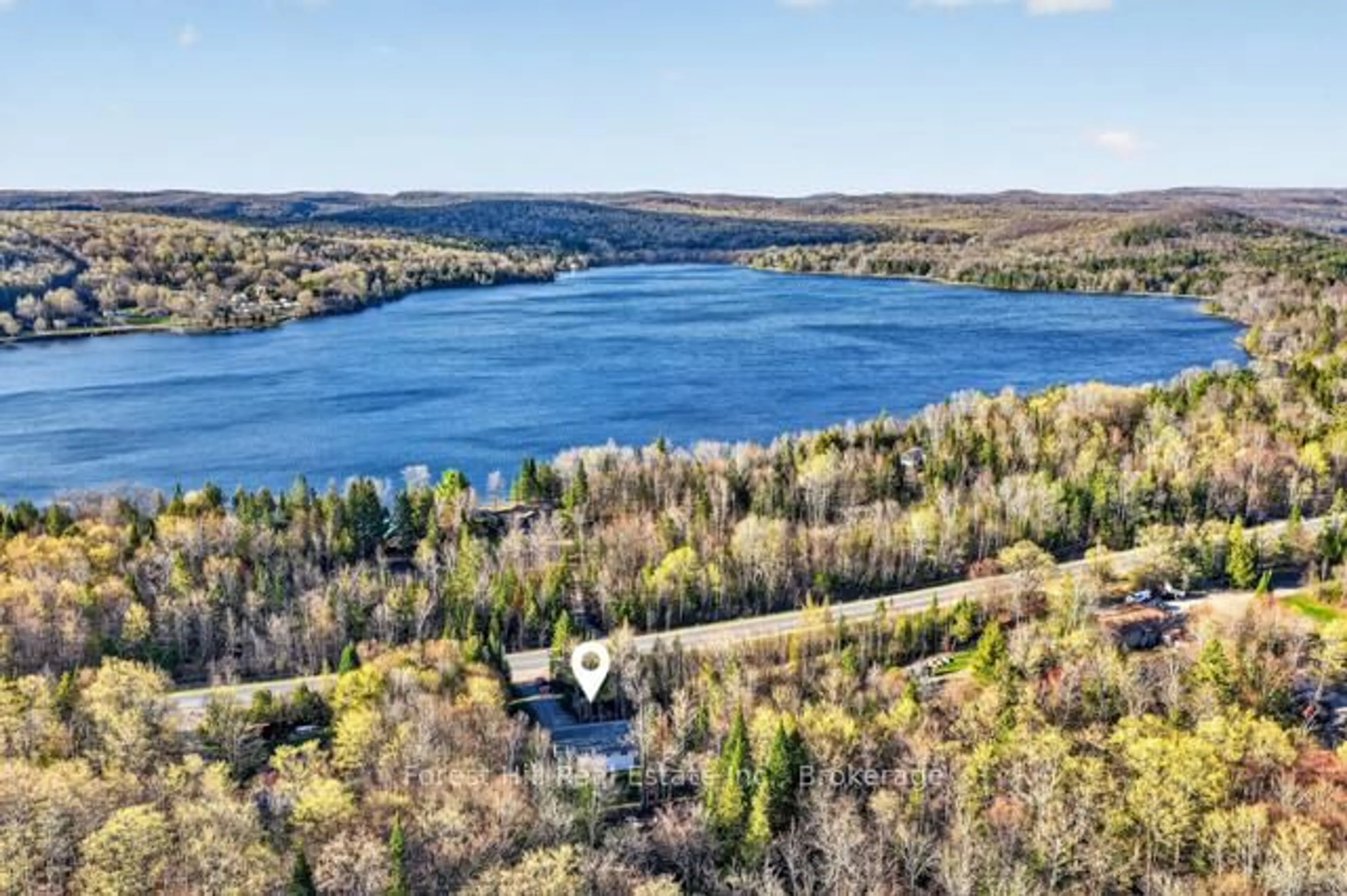 A pic from outside/outdoor area/front of a property/back of a property/a pic from drone, water/lake/river/ocean view for 1122 Eagle Lake Rd, Dysart et al Ontario K0M 1S0