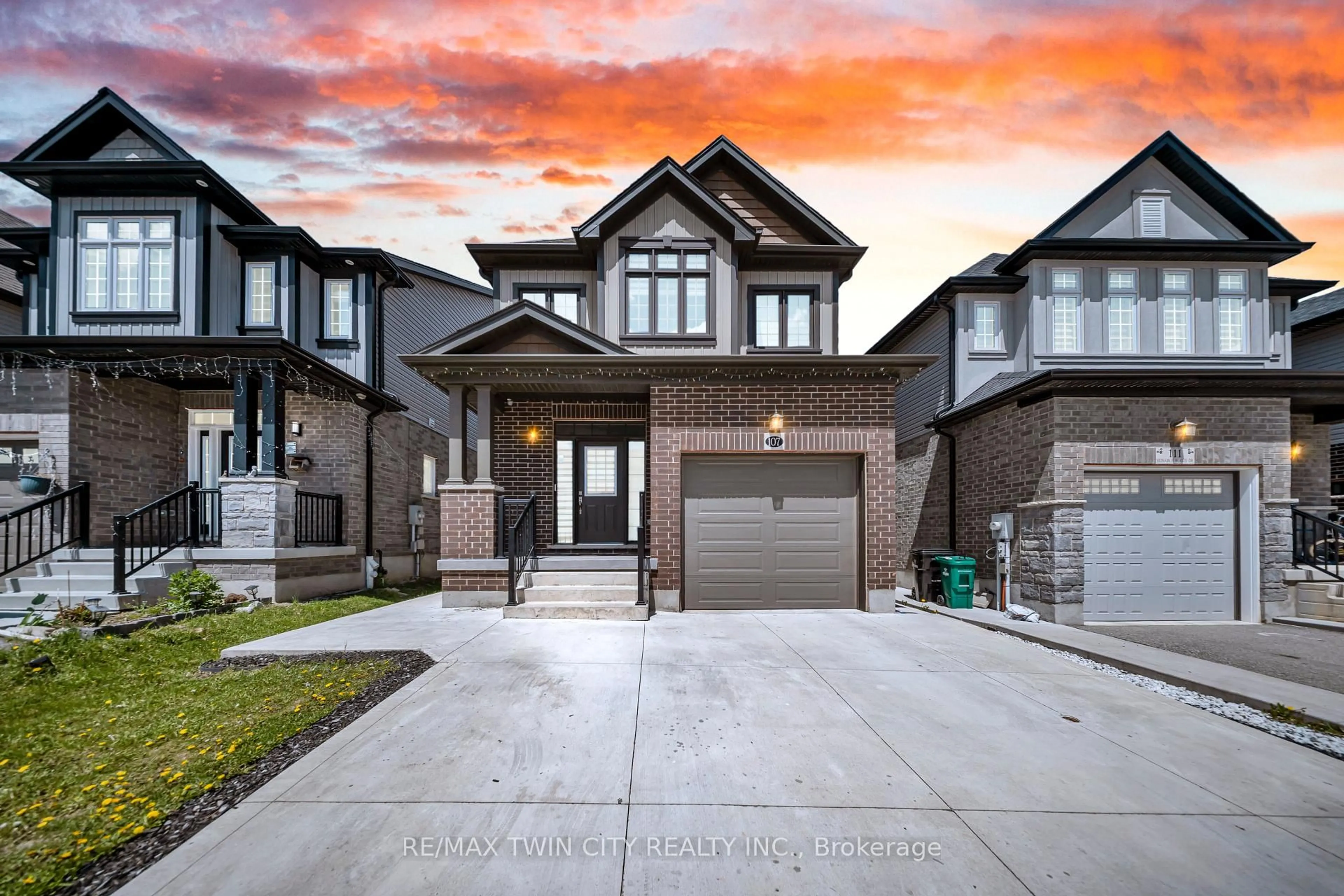 Home with brick exterior material, street for 107 Monarch Woods Dr, Kitchener Ontario N2P 0K2