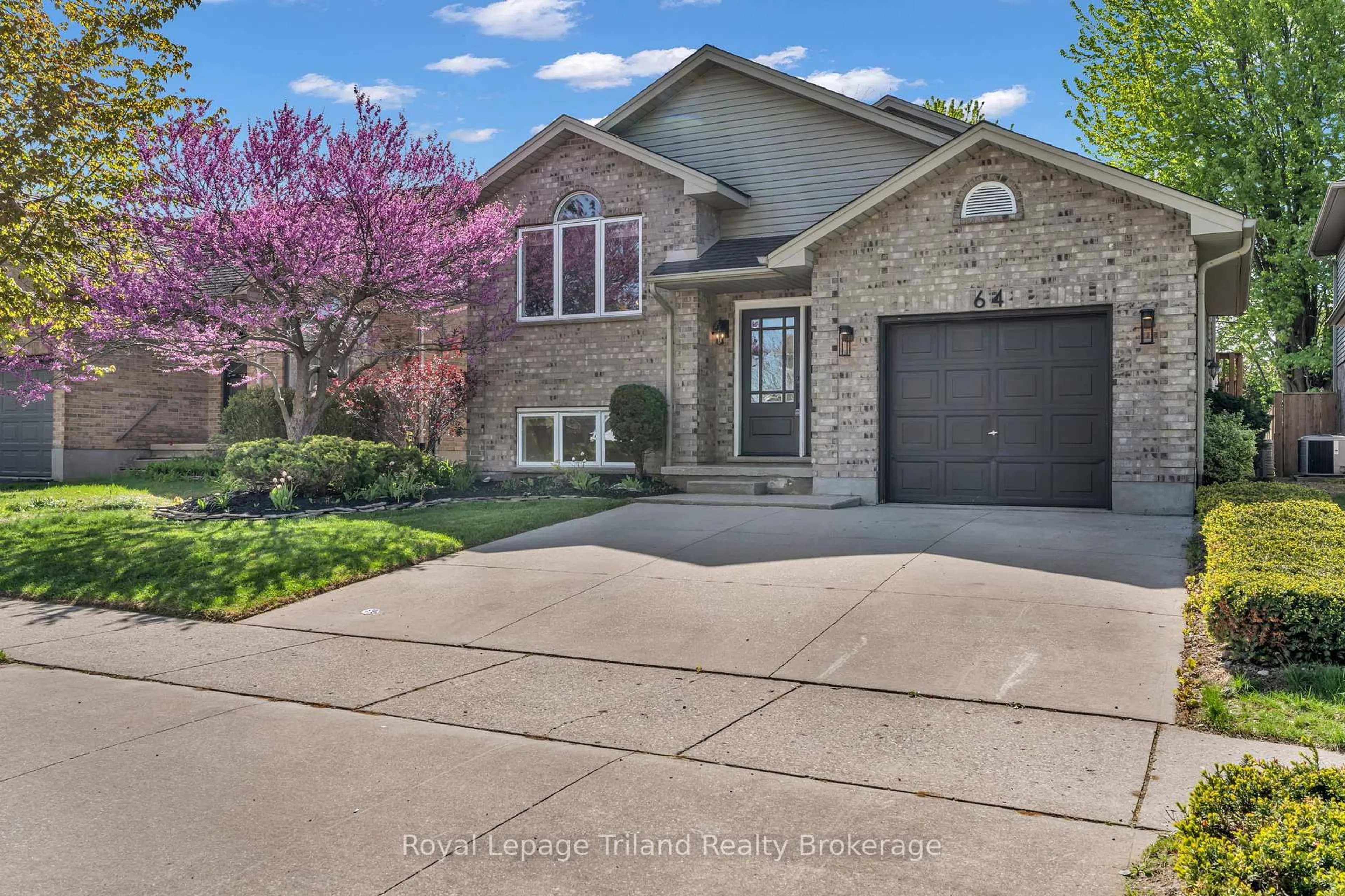 Home with brick exterior material, street for 64 Hickory Blvd, Strathroy-Caradoc Ontario N7G 4E9