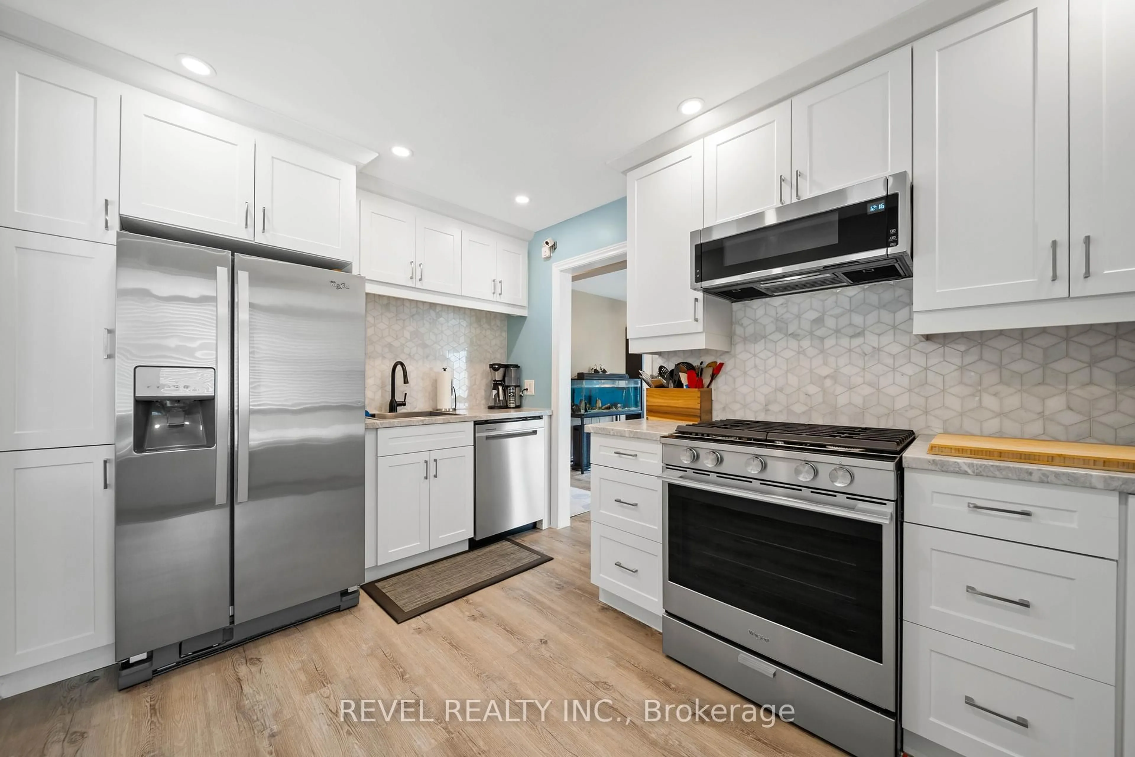 Open concept kitchen, ceramic/tile floor for 73 Queenston Cres, London East Ontario N5W 1N7