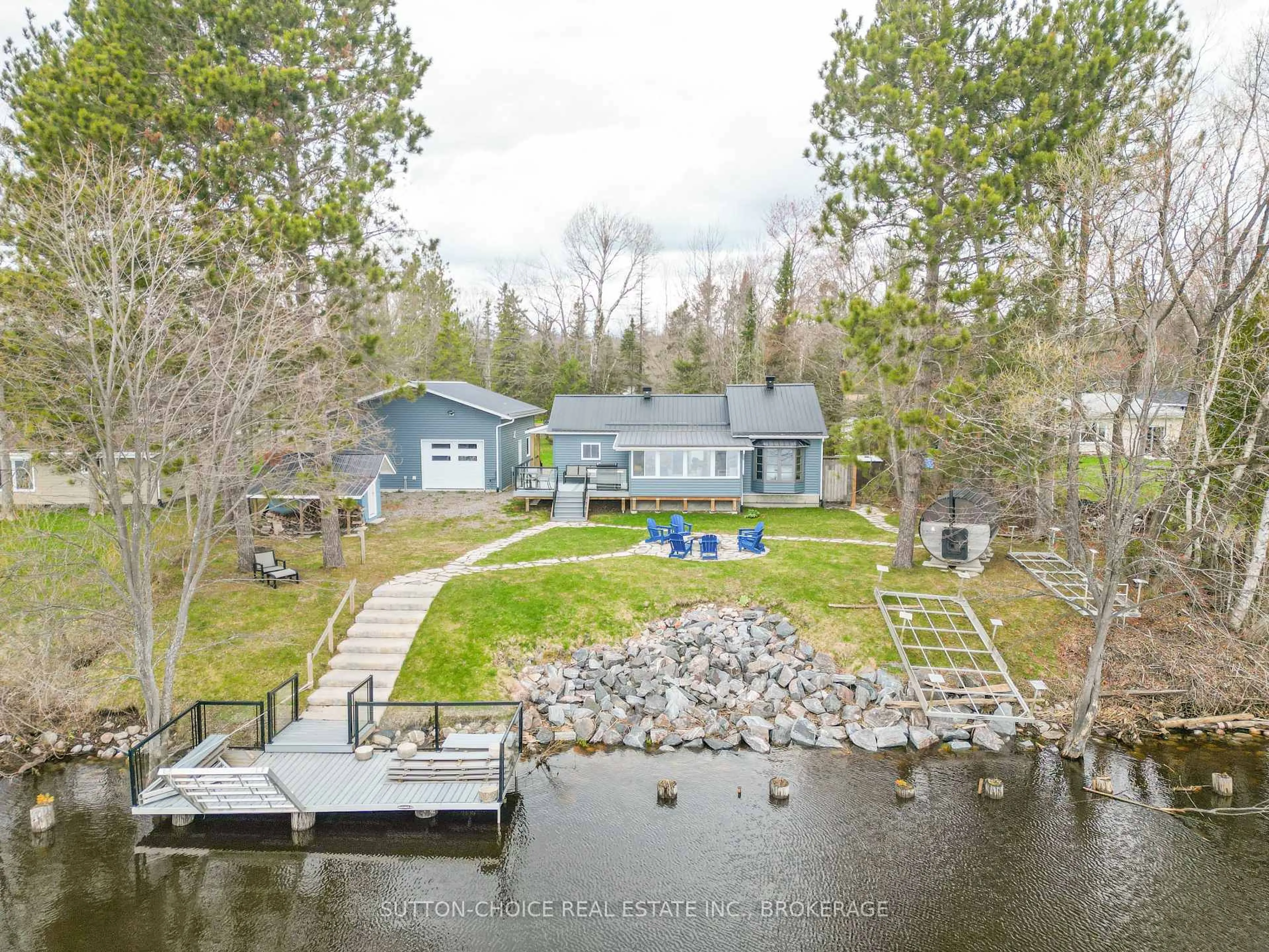 A pic from outside/outdoor area/front of a property/back of a property/a pic from drone, water/lake/river/ocean view for 399 Jocko Point Rd, North Bay Ontario P1B 8G5