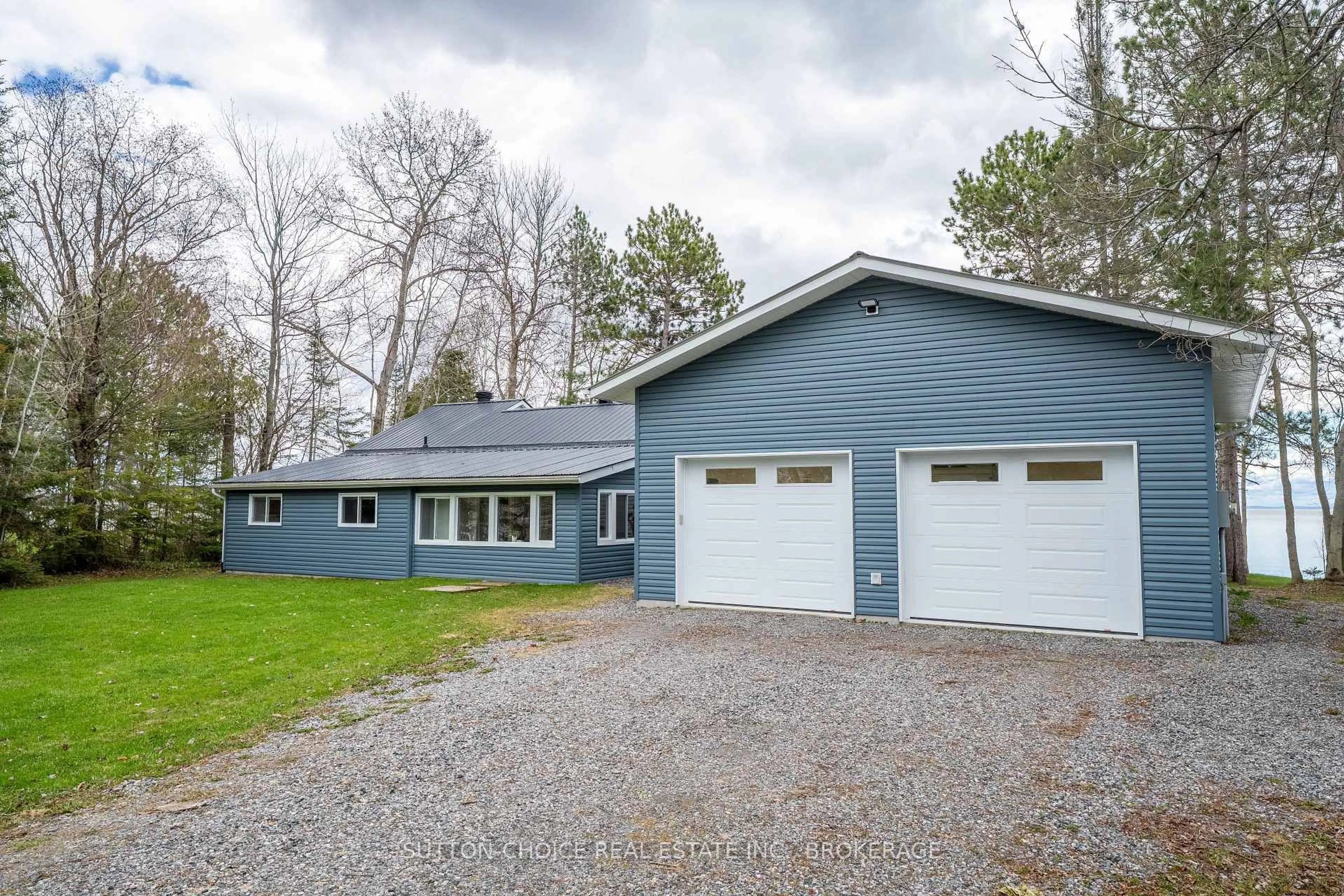 Home with vinyl exterior material, street for 399 Jocko Point Rd, North Bay Ontario P1B 8G5