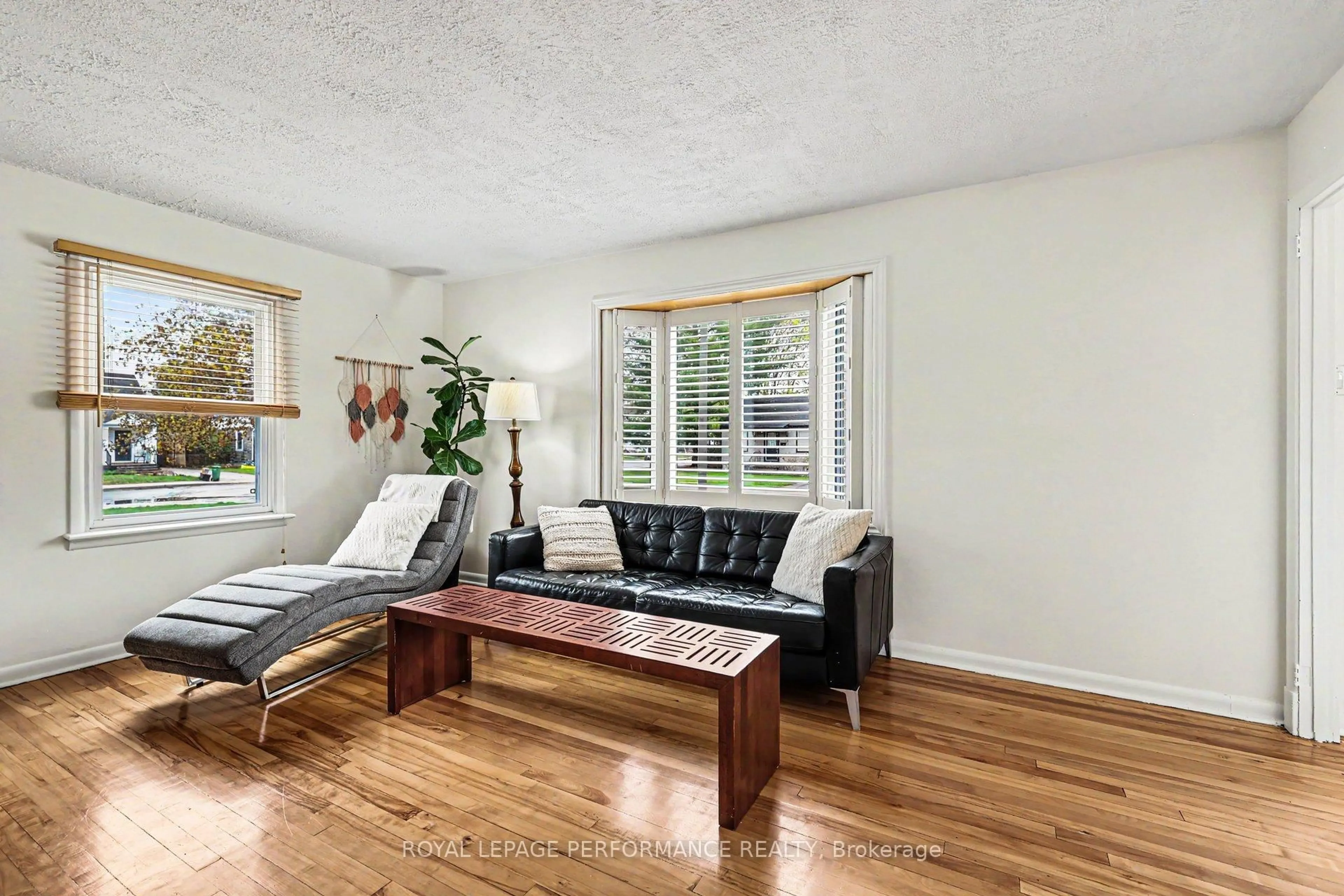 Living room with furniture, wood/laminate floor for 5 Marshall Ave, Ottawa Ontario K1Z 7X1