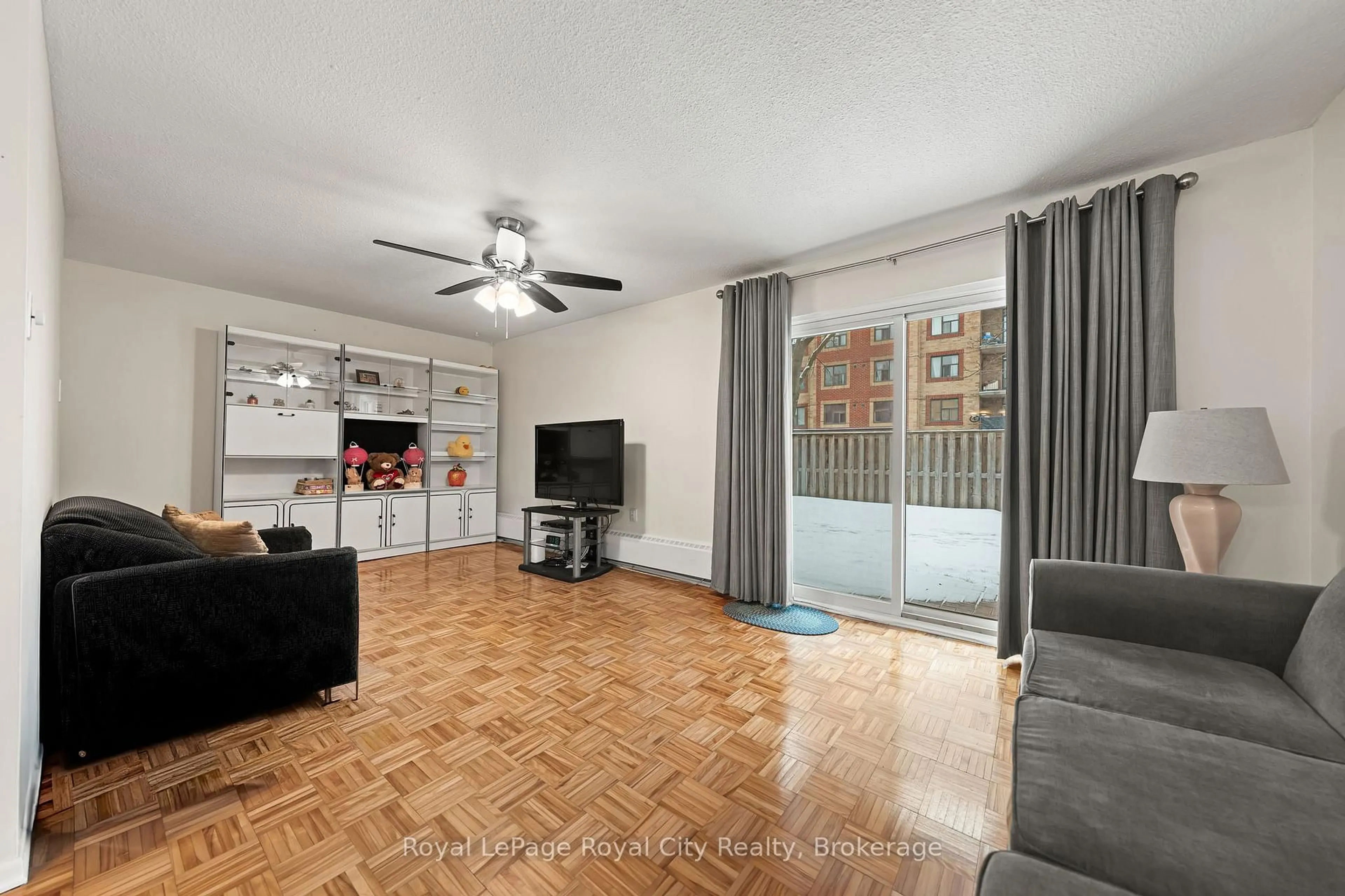 Living room with furniture, unknown for 234 Willow Rd #102, Guelph Ontario N1H 7C6