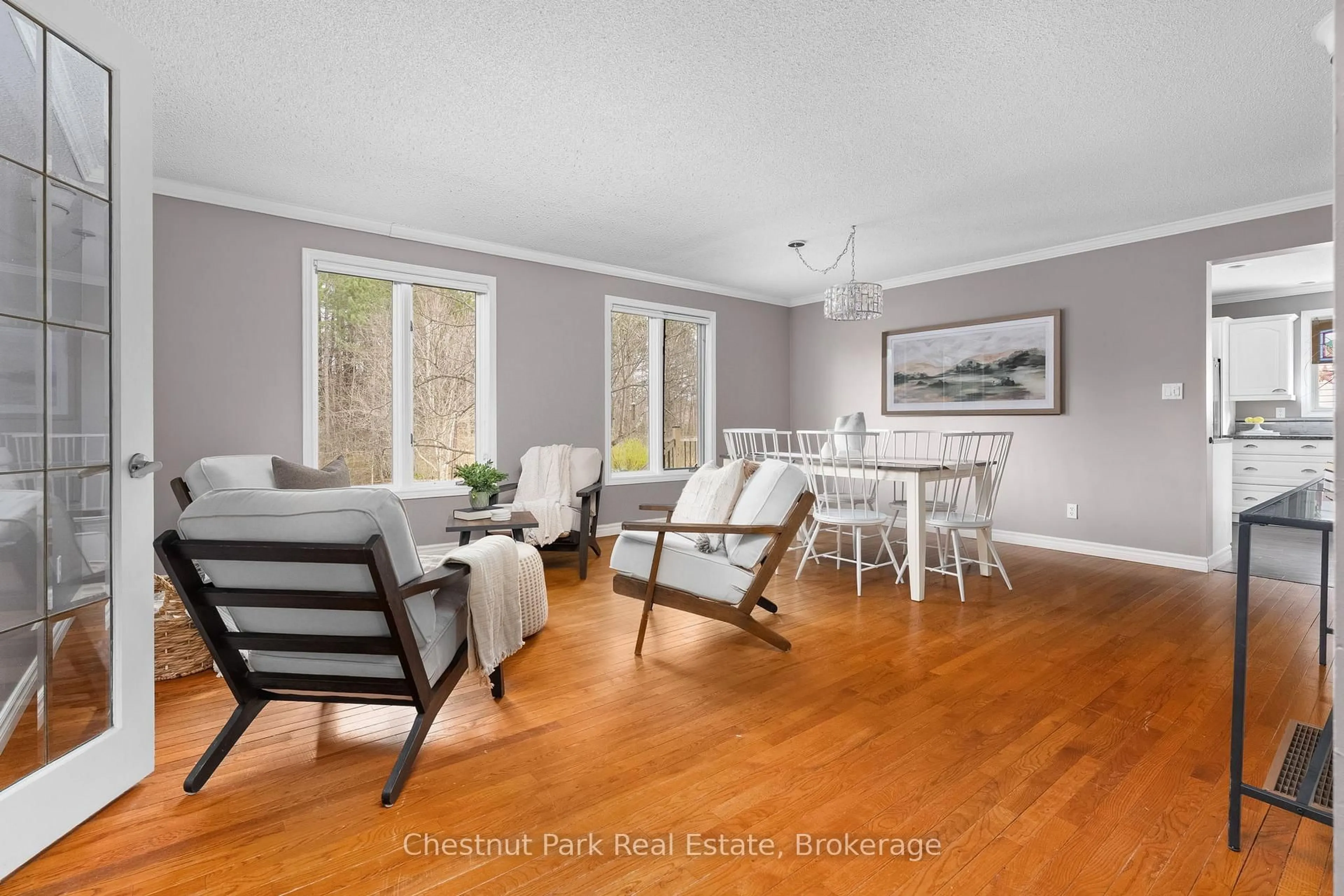 Living room with furniture, wood/laminate floor for 22 Glenwood Dr, Huntsville Ontario P1H 1B6