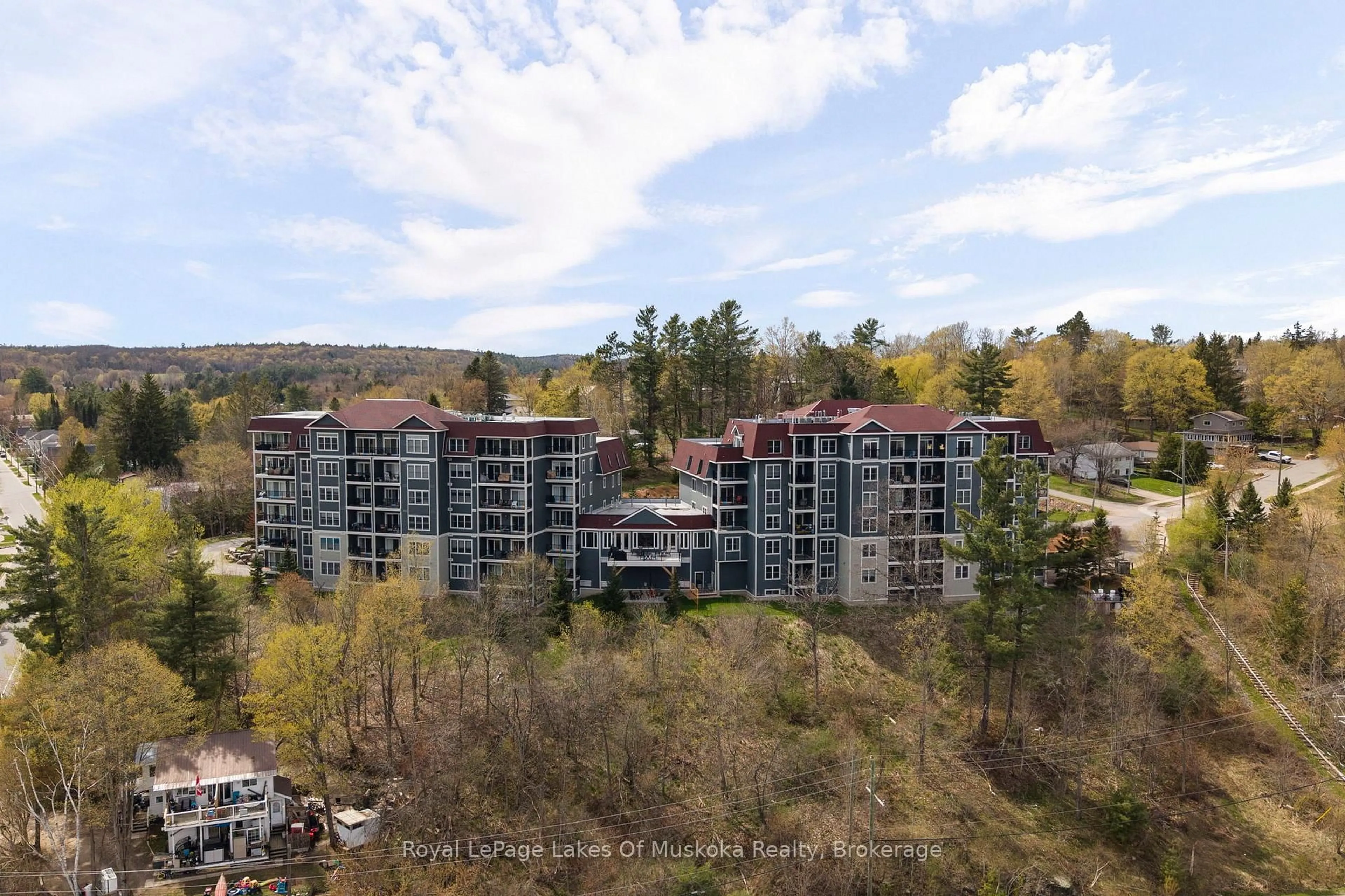 A pic from outside/outdoor area/front of a property/back of a property/a pic from drone, unknown for 10 Kimberley Ave #103, Bracebridge Ontario P1L 0A4