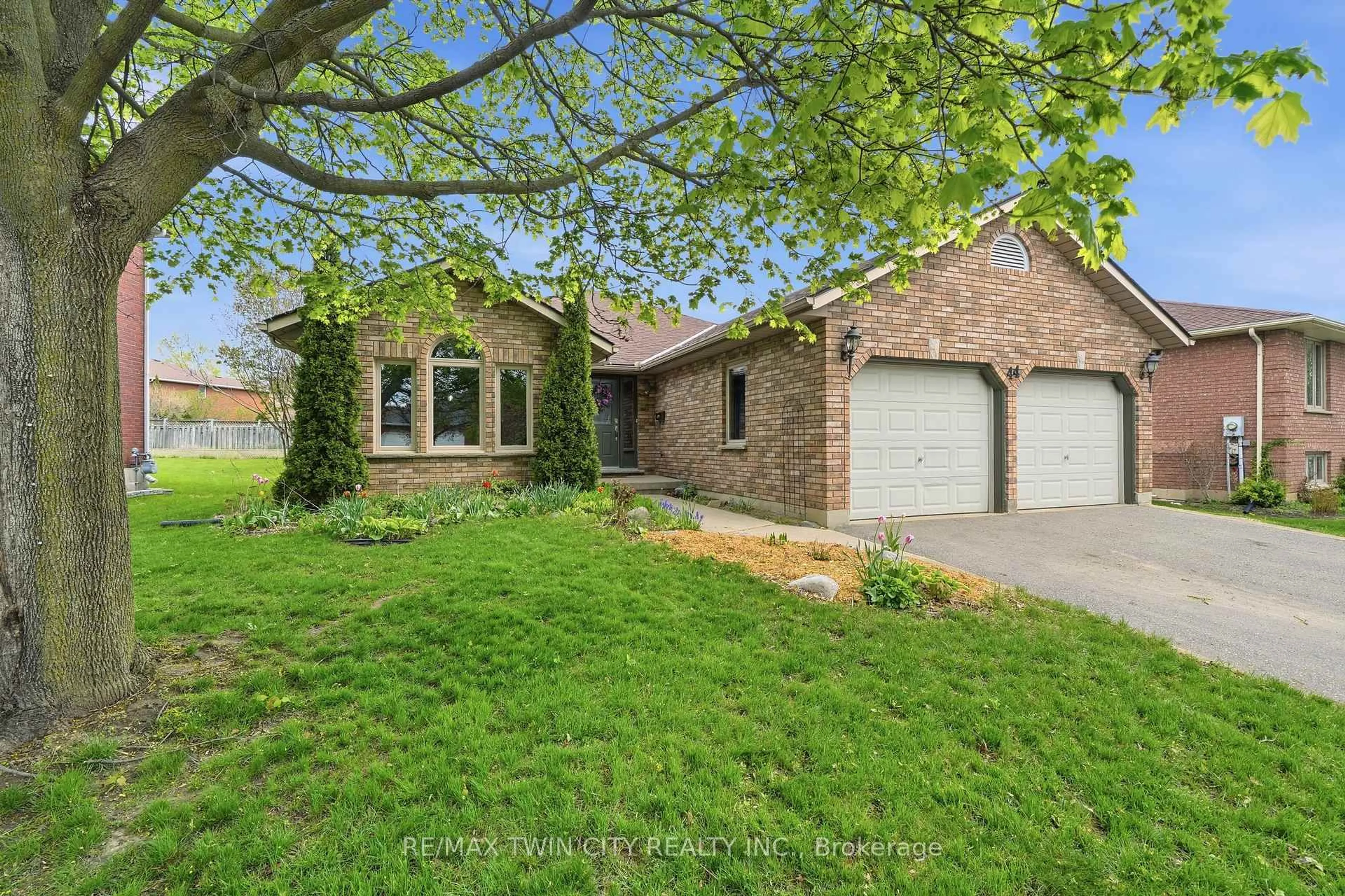 Home with brick exterior material, street for 44 Blackfriar Lane, Brantford Ontario N3R 7L3