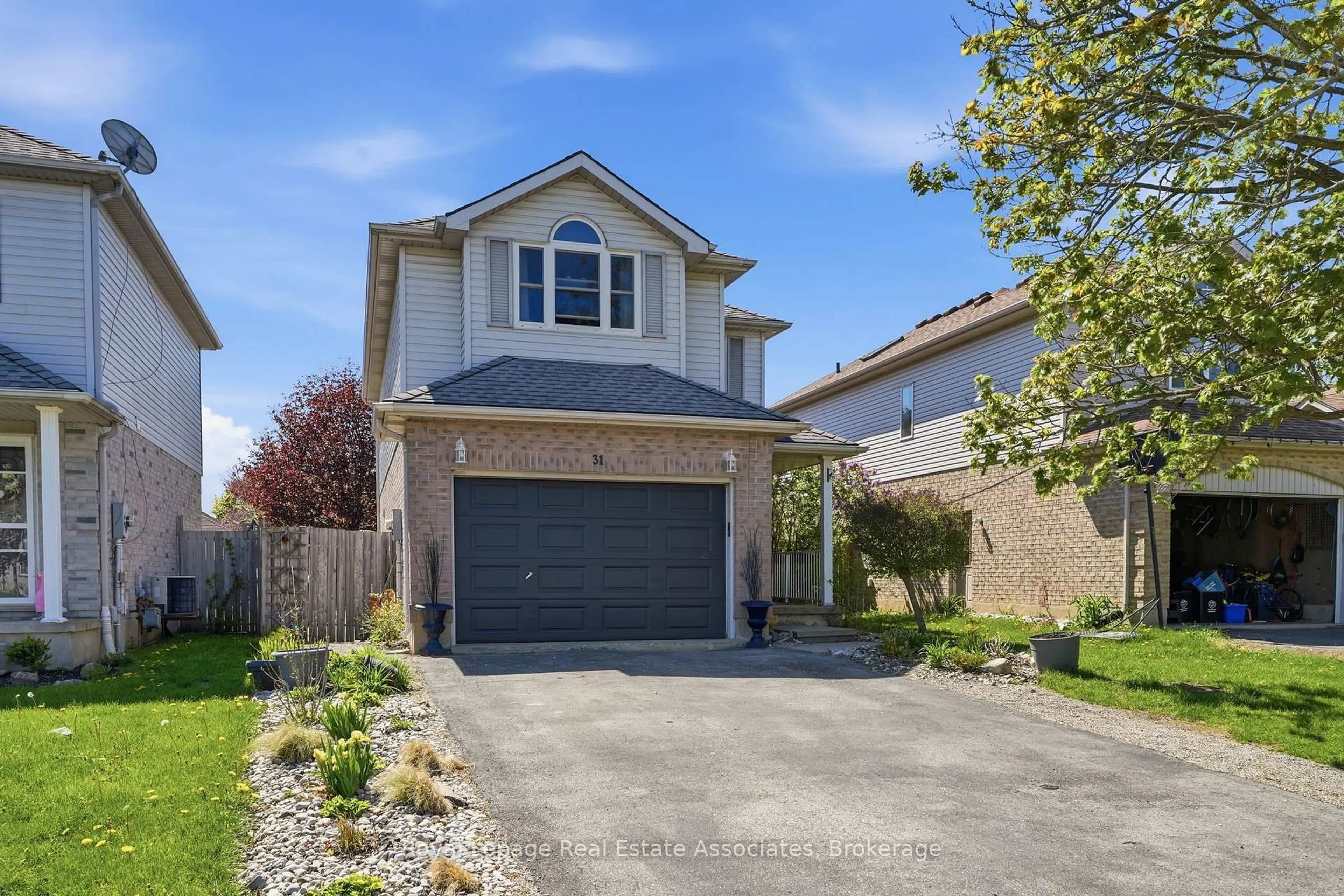 Home with brick exterior material, street for 31 Tulip Dr, Tillsonburg Ontario N4G 5S5