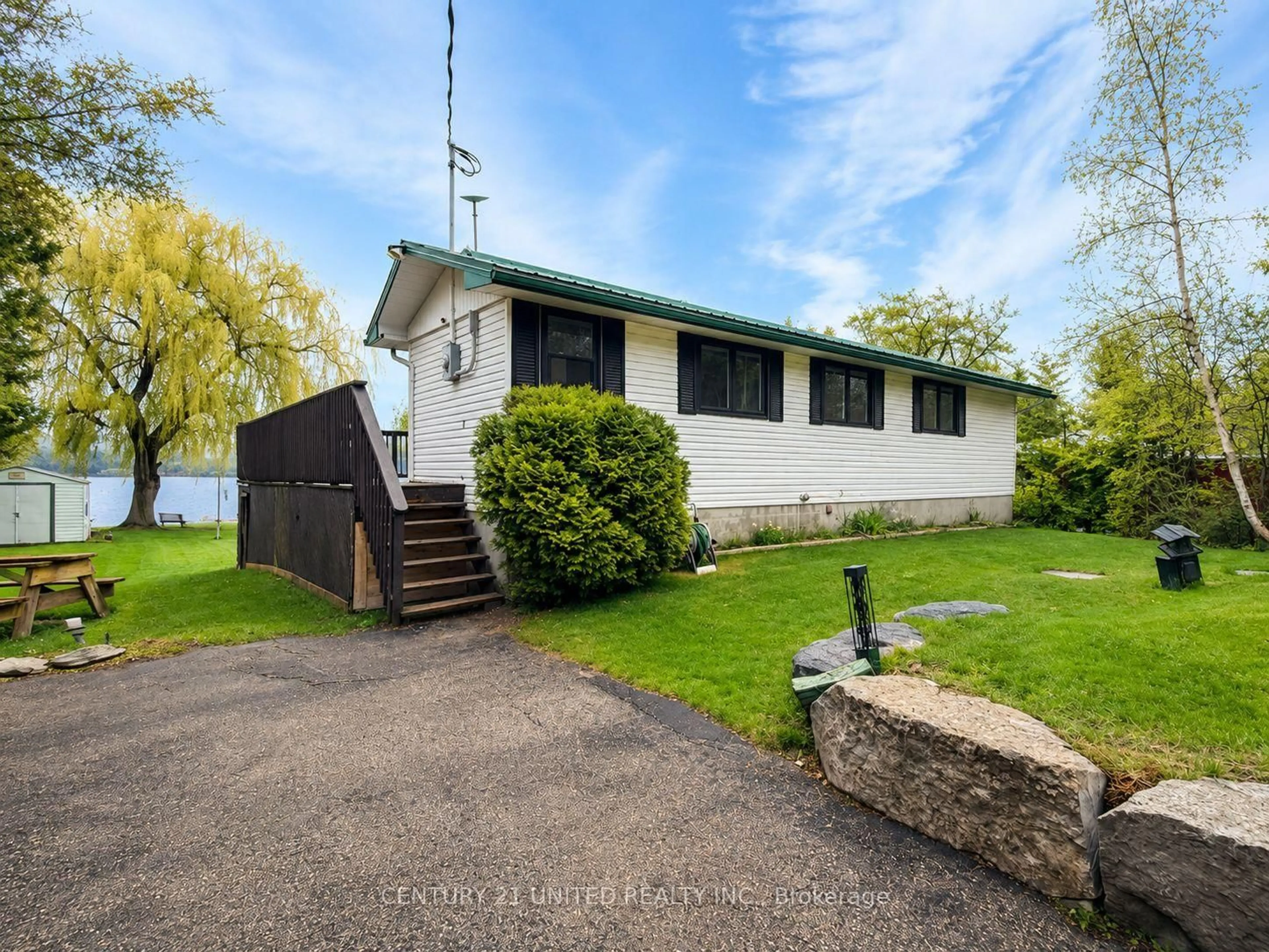 A pic from outside/outdoor area/front of a property/back of a property/a pic from drone, water/lake/river/ocean view for 16 Evergreen St, Kawartha Lakes Ontario K0L 2W0