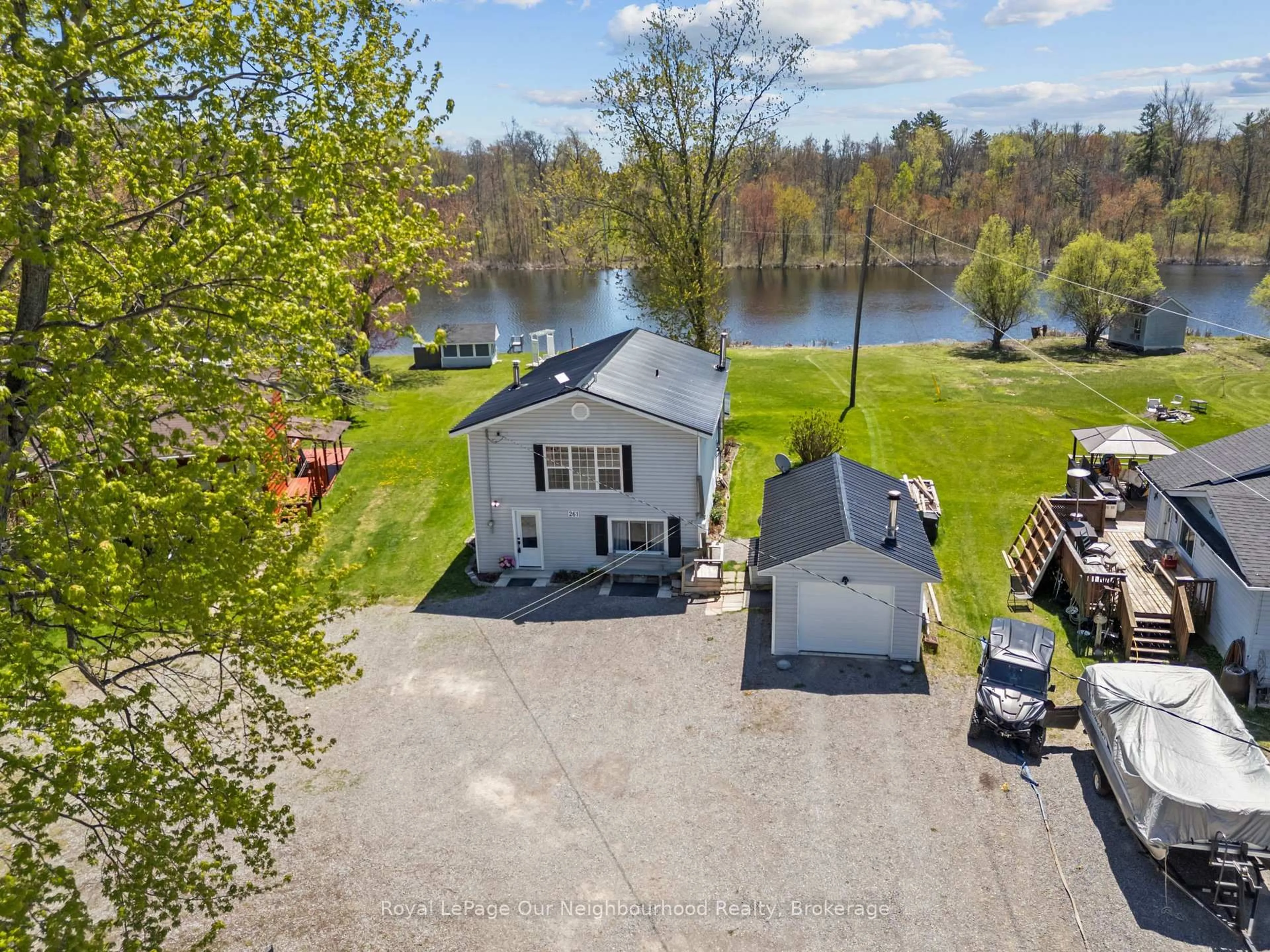A pic from outside/outdoor area/front of a property/back of a property/a pic from drone, water/lake/river/ocean view for 261 River Rd, Trent Hills Ontario K0L 1L0