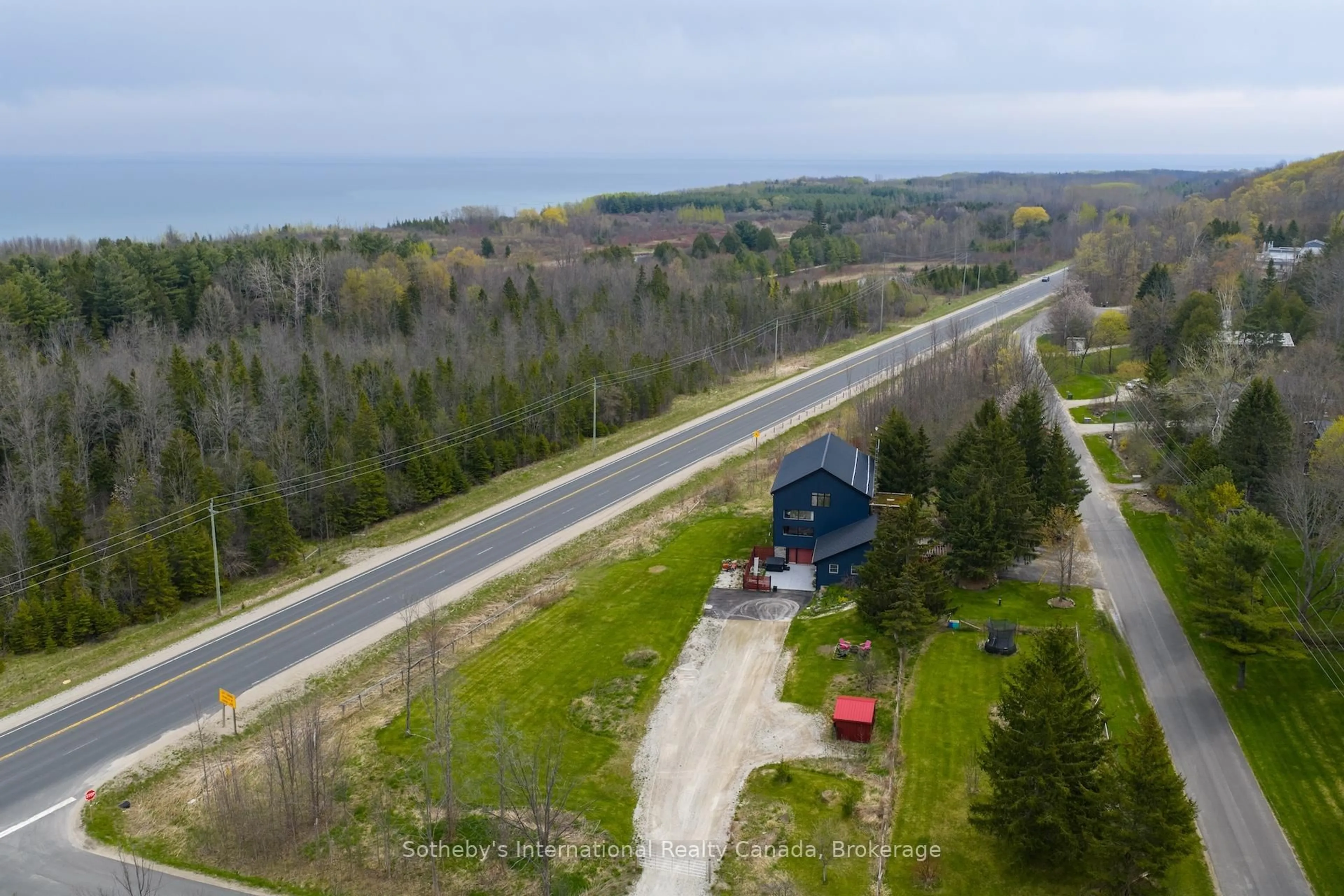A pic from outside/outdoor area/front of a property/back of a property/a pic from drone, water/lake/river/ocean view for 121 Old Highway 26, Meaford Ontario N4L 1W7