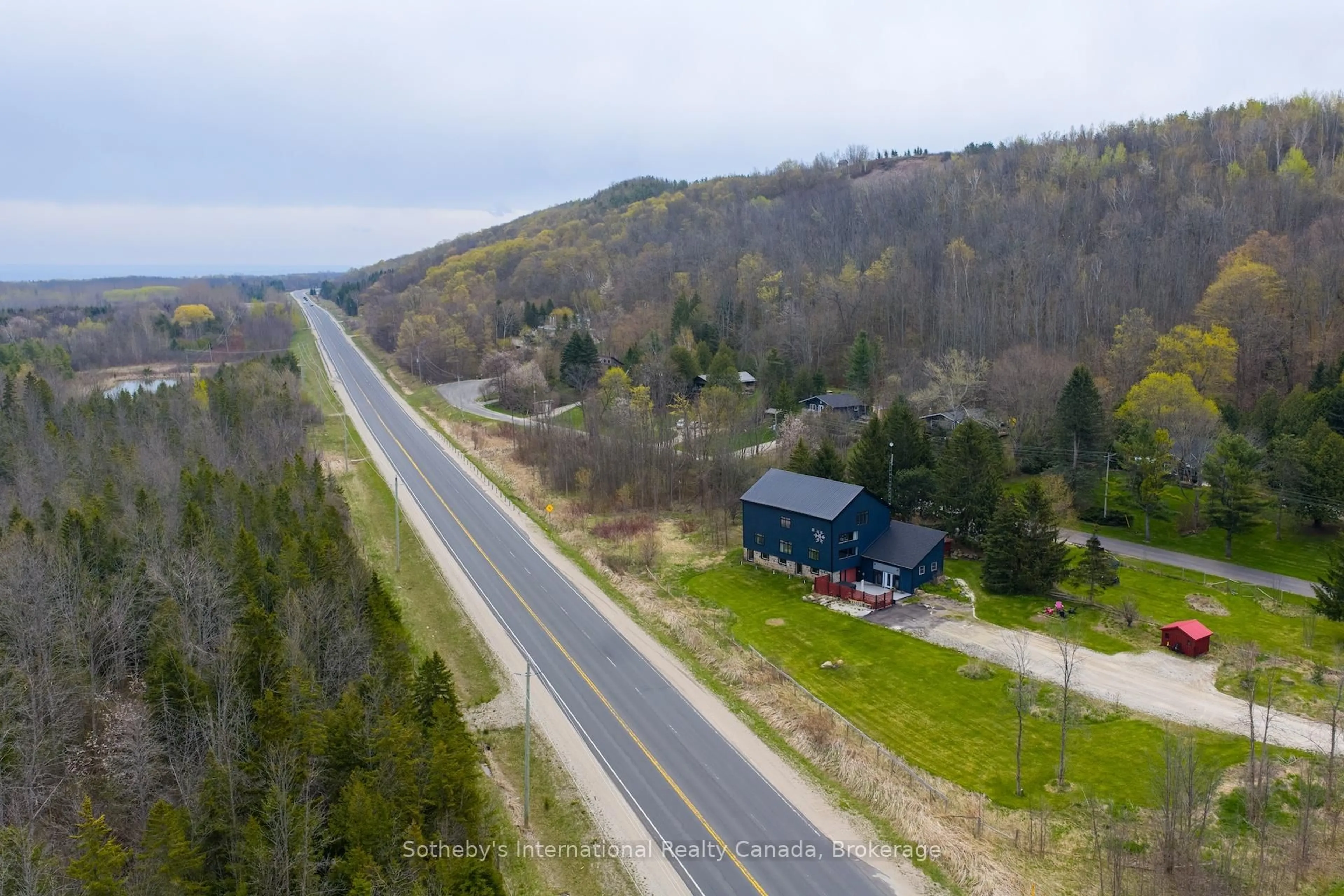A pic from outside/outdoor area/front of a property/back of a property/a pic from drone, unknown for 121 Old Highway 26, Meaford Ontario N4L 1W7