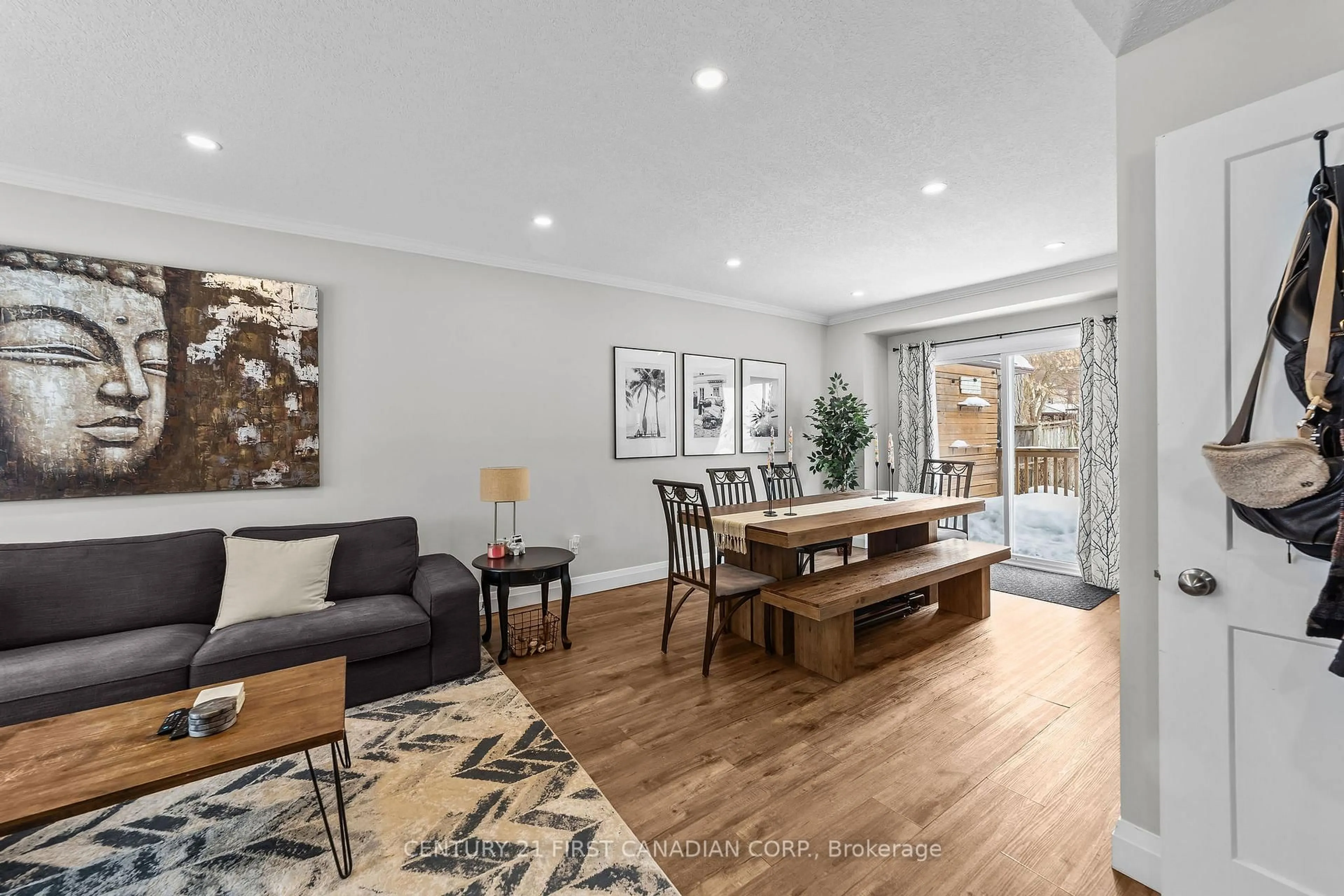 Living room with furniture, wood/laminate floor for 474 Woodman Ave, London East Ontario N5W 3Z9