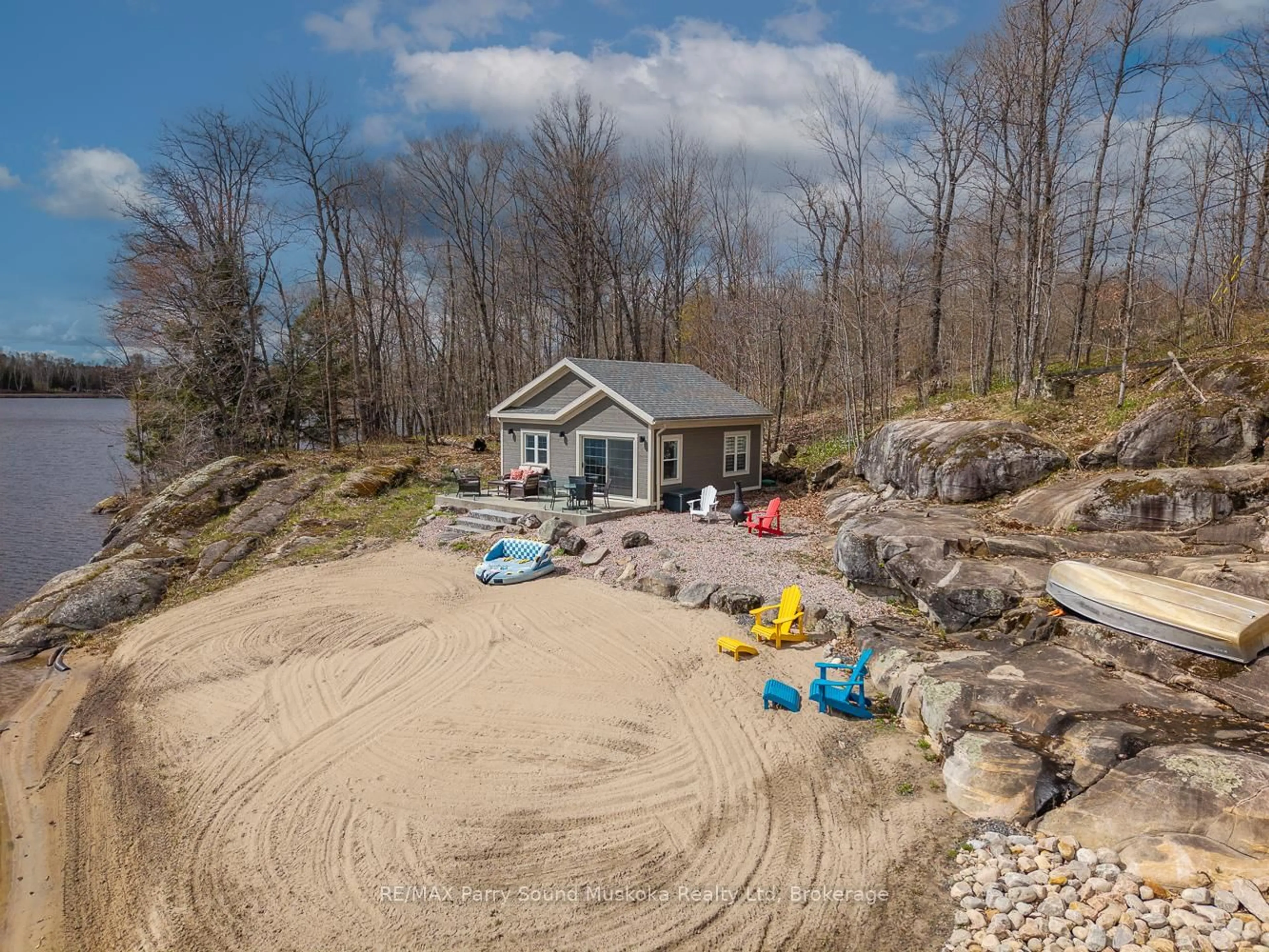 A pic from outside/outdoor area/front of a property/back of a property/a pic from drone, water/lake/river/ocean view for 58 Tait's Island Rd, McKellar Ontario P2A 0B4
