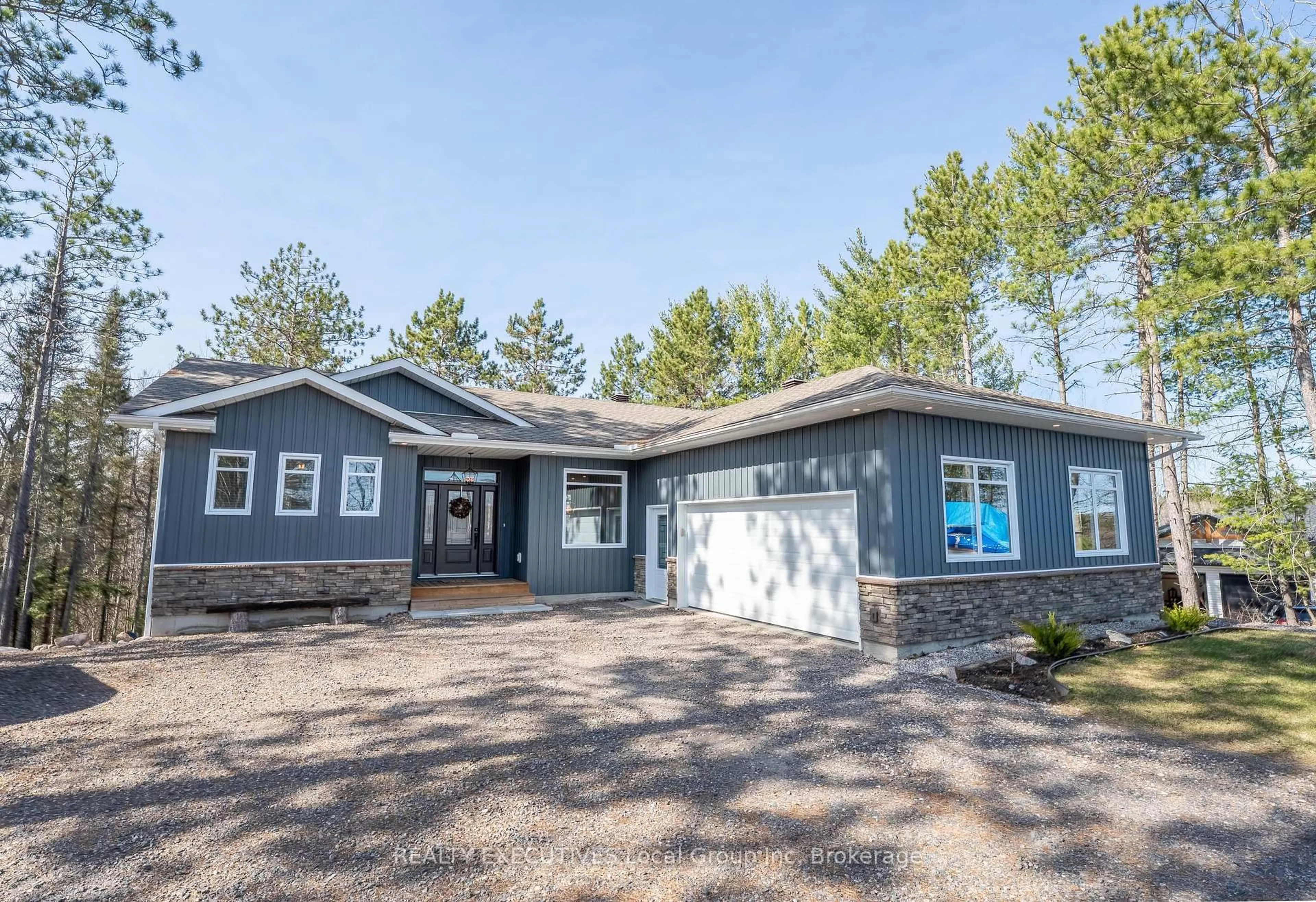 Home with vinyl exterior material, street for 87 Oakridge Dr, East Ferris Ontario P0H 1K0