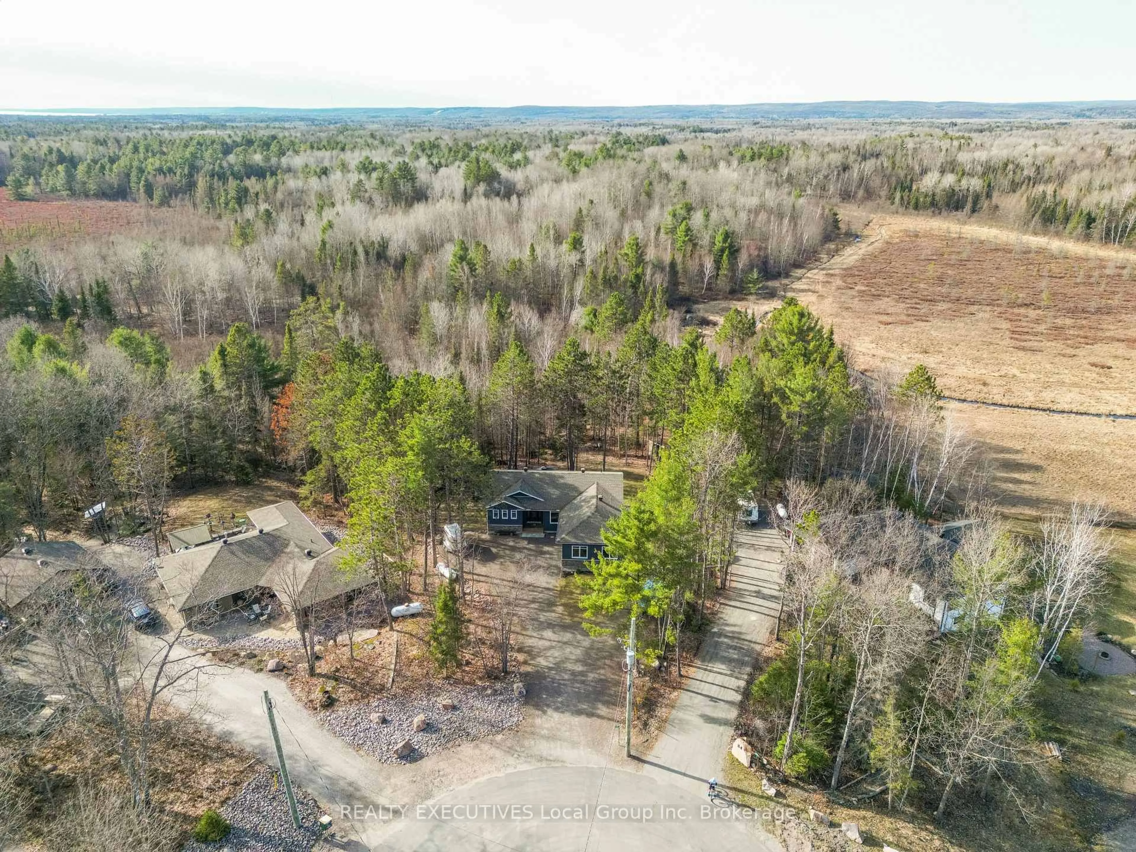 A pic from outside/outdoor area/front of a property/back of a property/a pic from drone, forest/trees view for 87 Oakridge Dr, East Ferris Ontario P0H 1K0