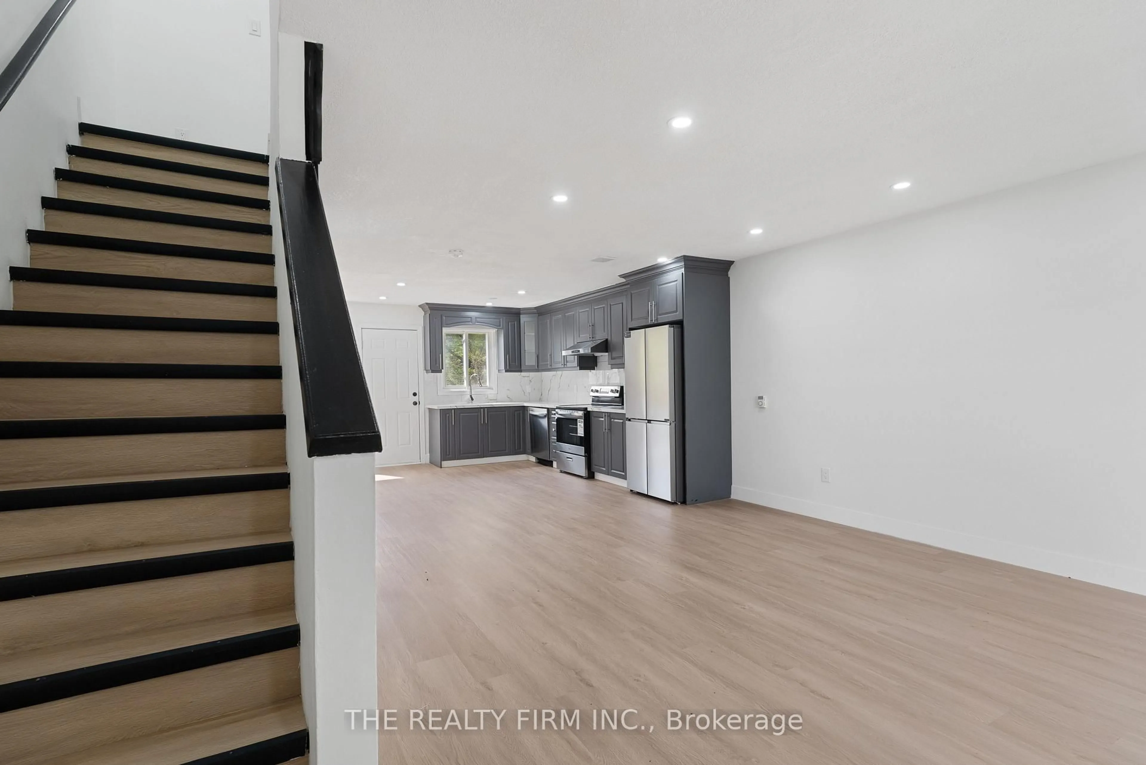 Open concept kitchen, wood/laminate floor for 1443 Huron St #26, London East Ontario N5V 2E6