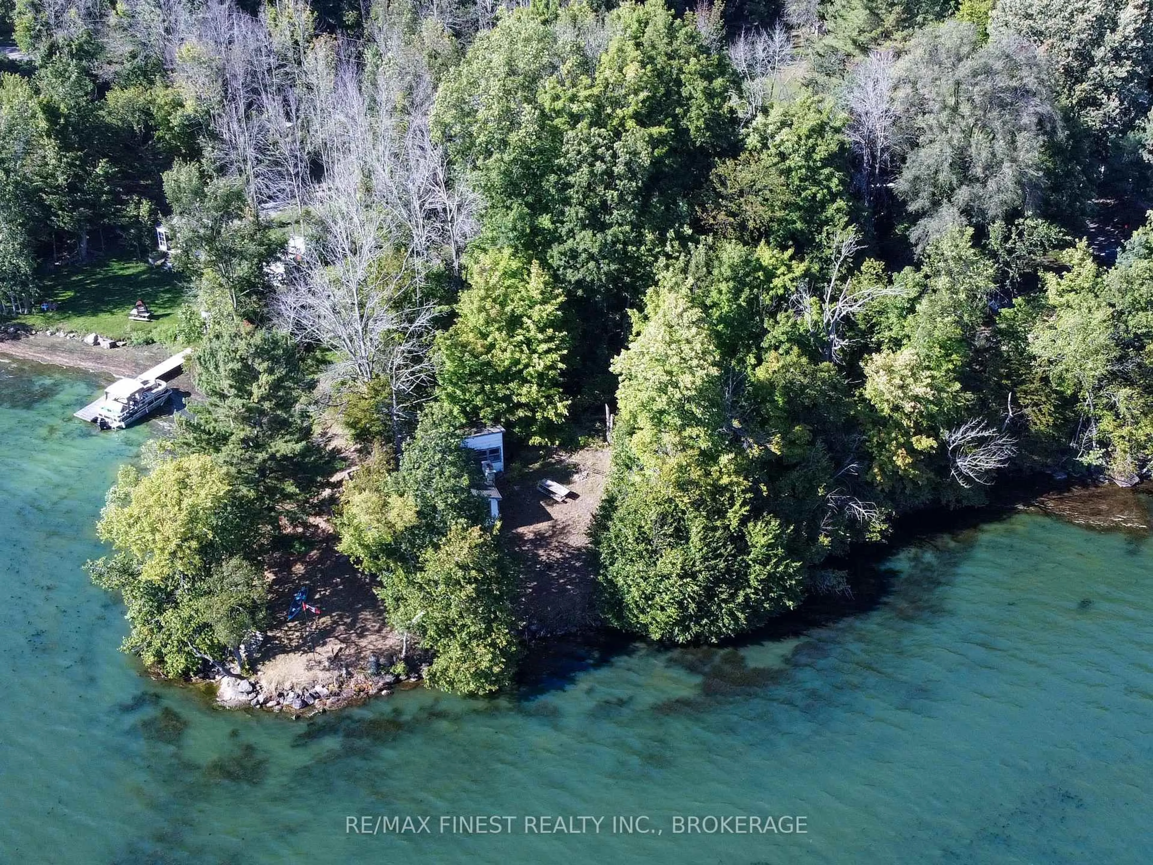 A pic from outside/outdoor area/front of a property/back of a property/a pic from drone, water/lake/river/ocean view for 4049 Hiawatha Lane, Battersea Ontario K0H 1H0