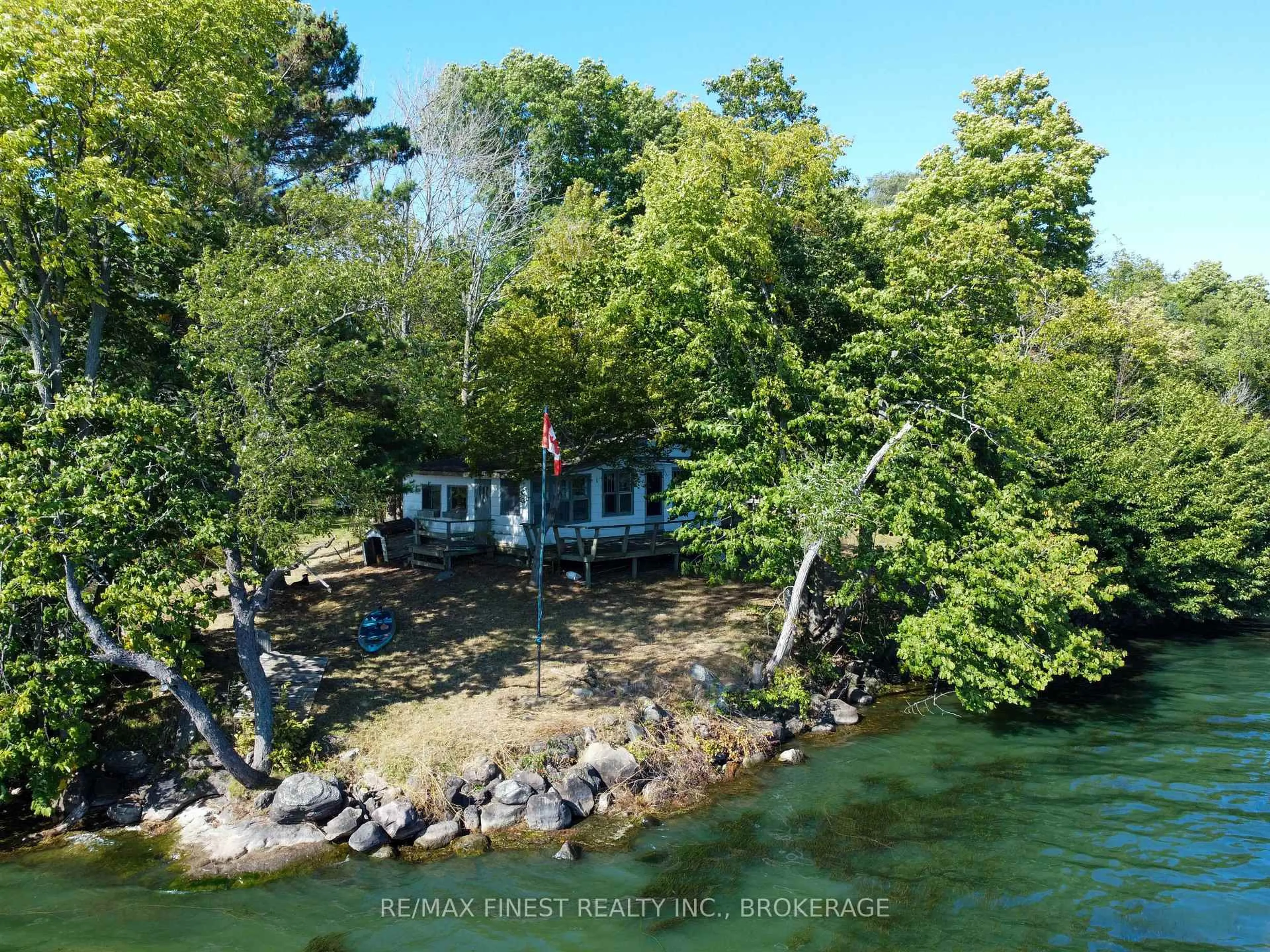 A pic from outside/outdoor area/front of a property/back of a property/a pic from drone, water/lake/river/ocean view for 4049 Hiawatha Lane, Battersea Ontario K0H 1H0
