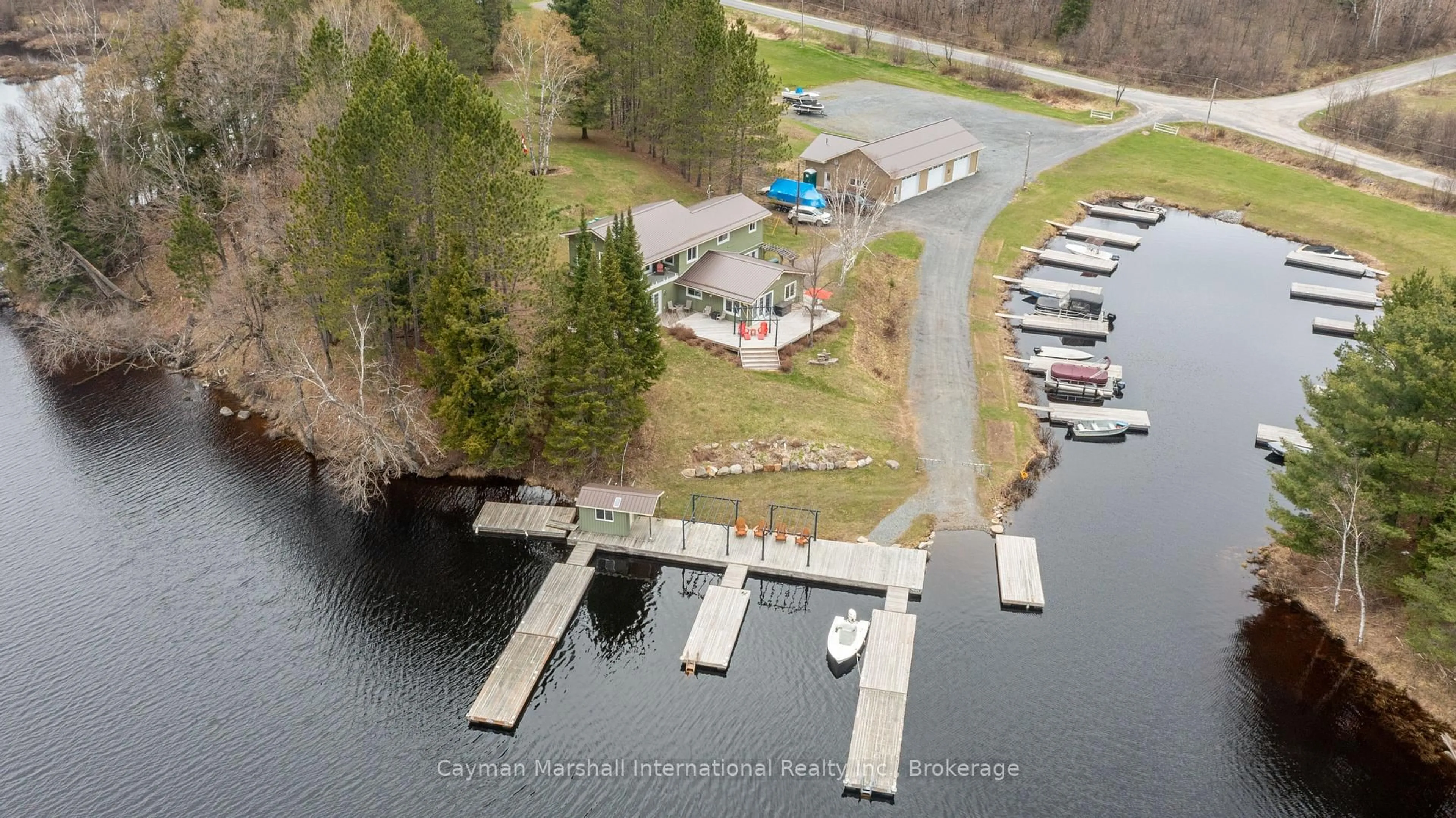 A pic from outside/outdoor area/front of a property/back of a property/a pic from drone, water/lake/river/ocean view for 143 South Dr, Huntsville Ontario P1H 2J2