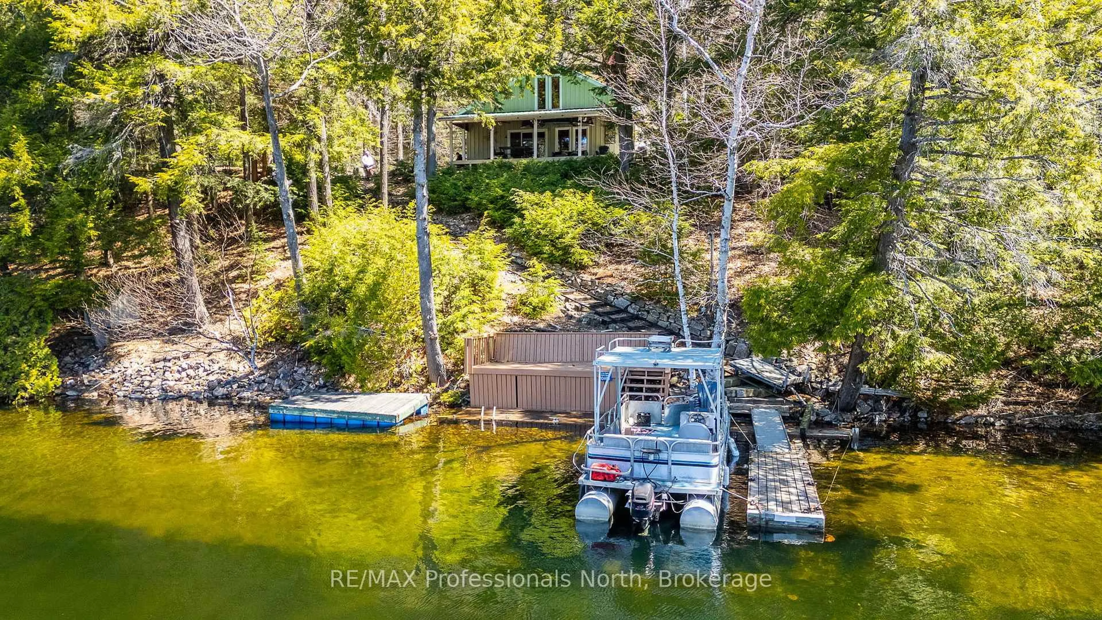 A pic from outside/outdoor area/front of a property/back of a property/a pic from drone, water/lake/river/ocean view for 10469 Little Hawk Lake WAO, Algonquin Highlands Ontario K0M 1S0